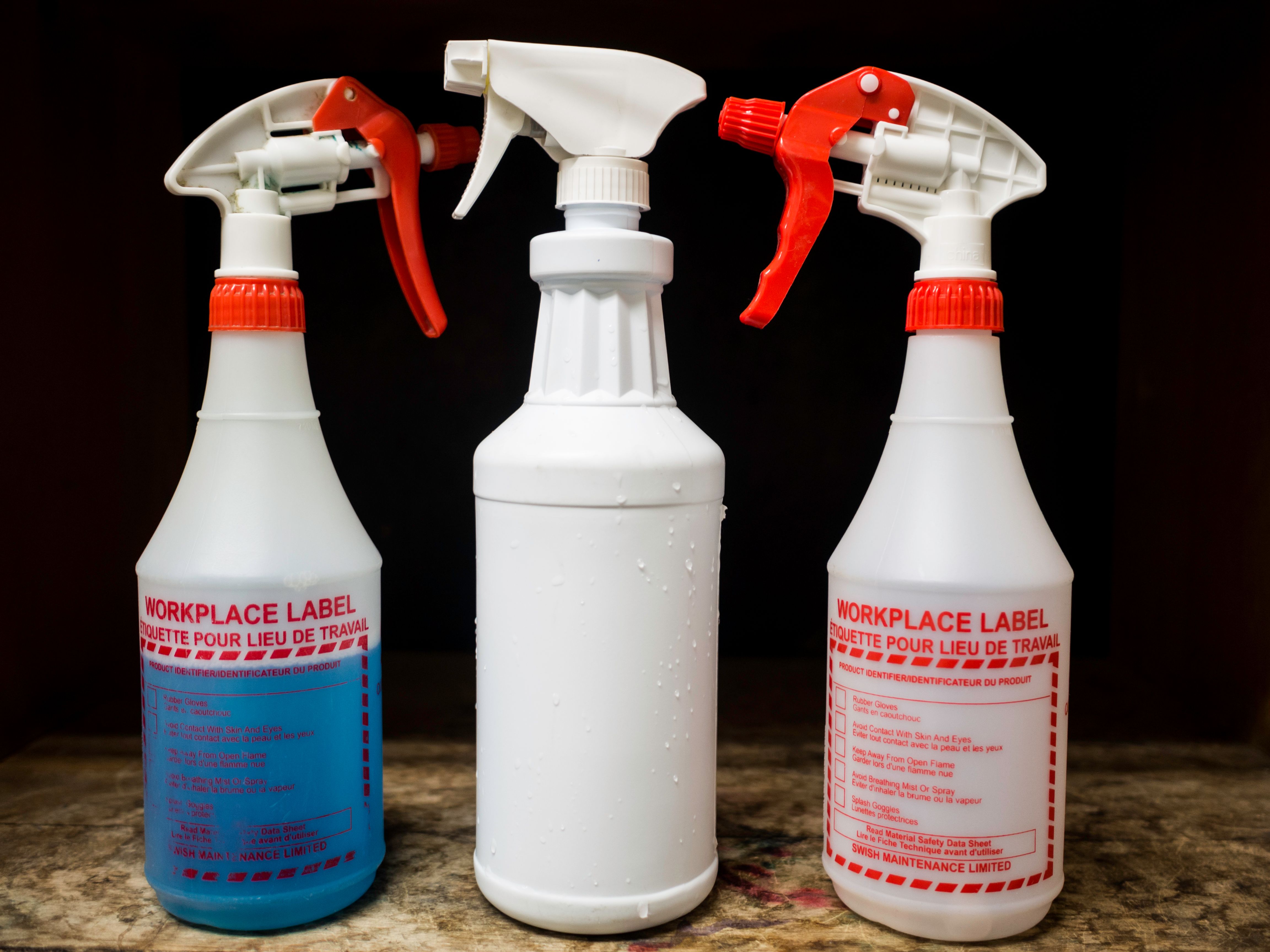 janitorial supplies cleaning spray bottles plastic writing words wood shelves janitorial supplies cleaning spray bottles plastic writing words wood shelves