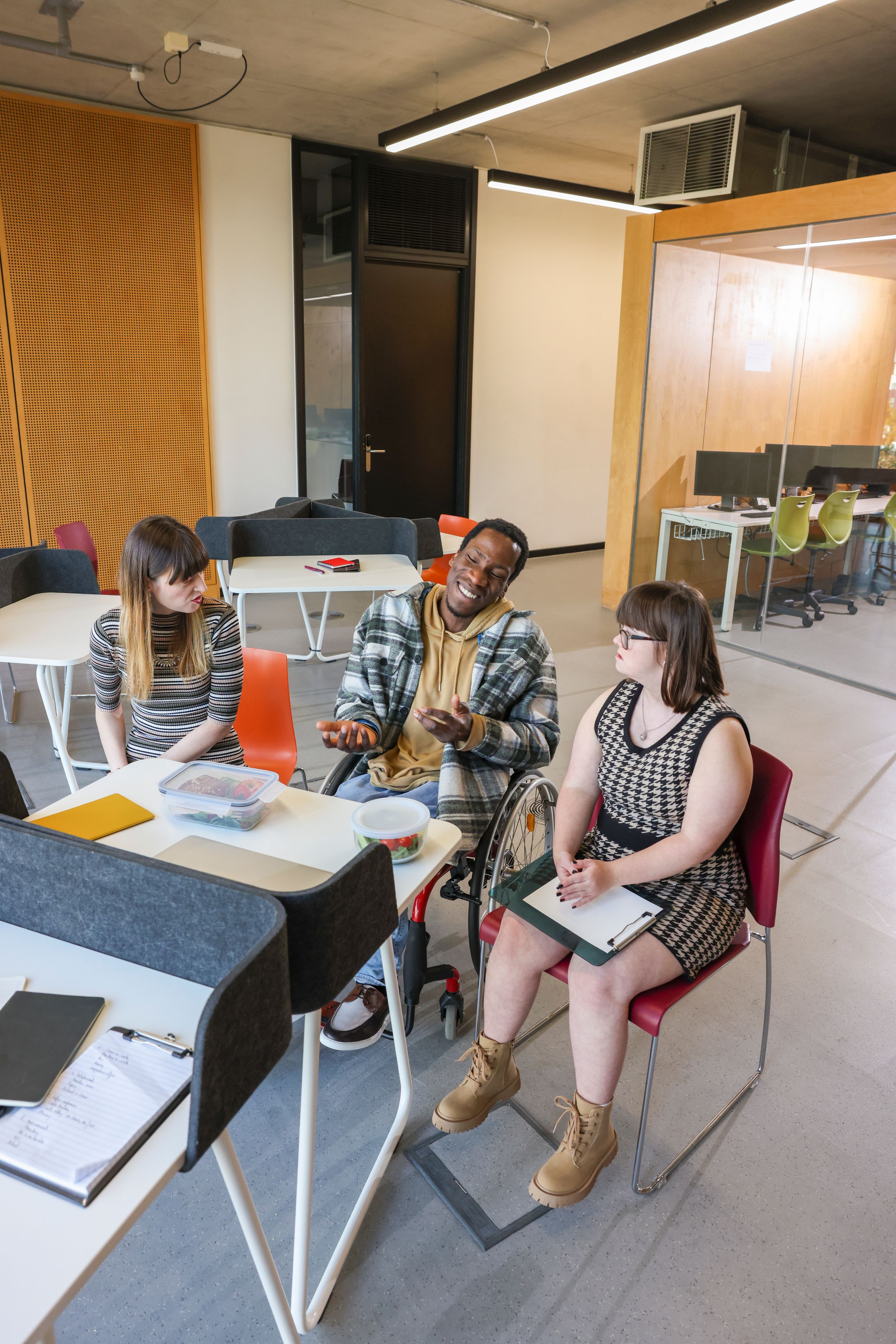 Disabled coworkers in modern office