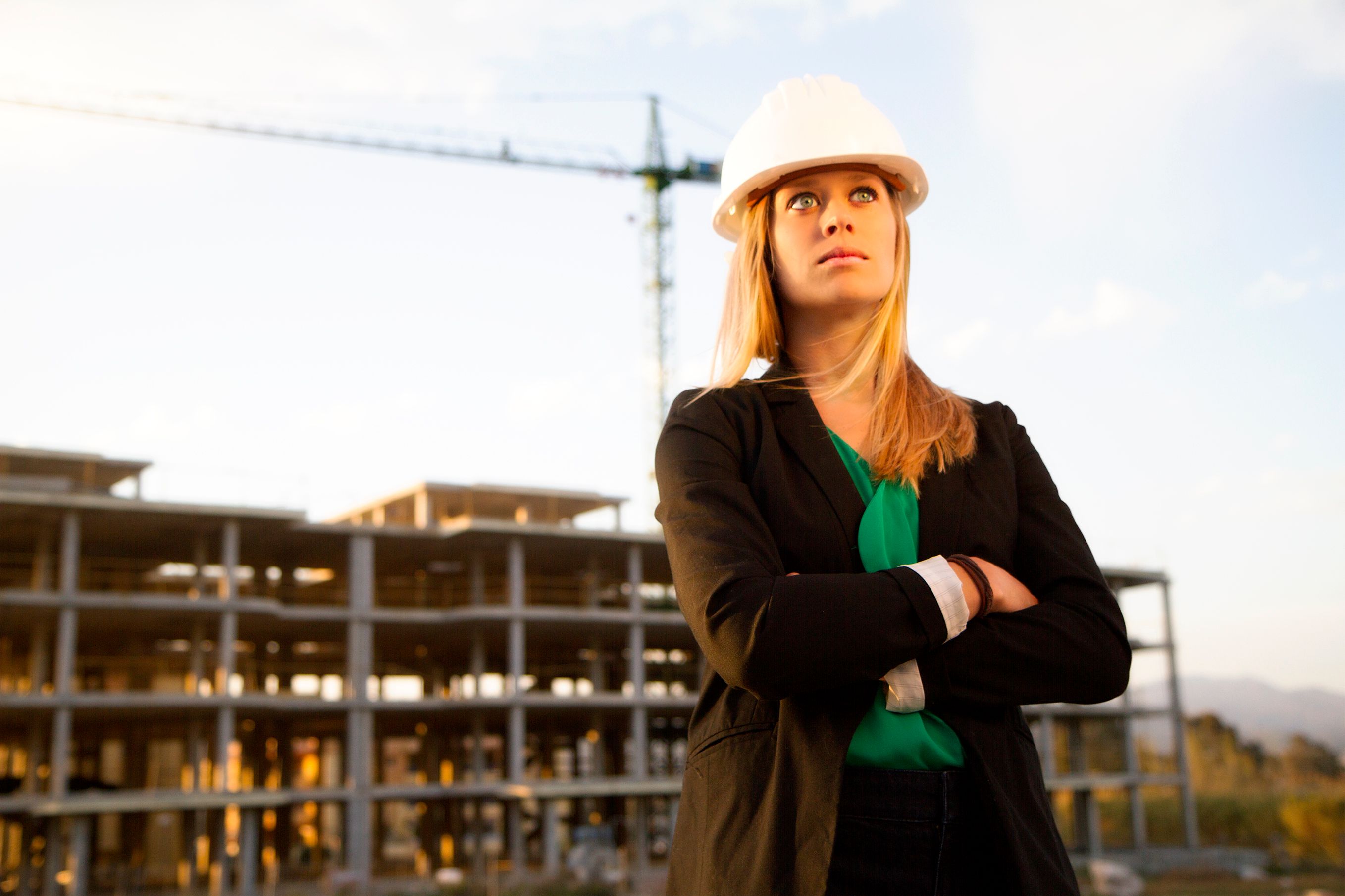 Female Engineer Standing in Front of Construction Female Engineer Standing in Front of Construction
