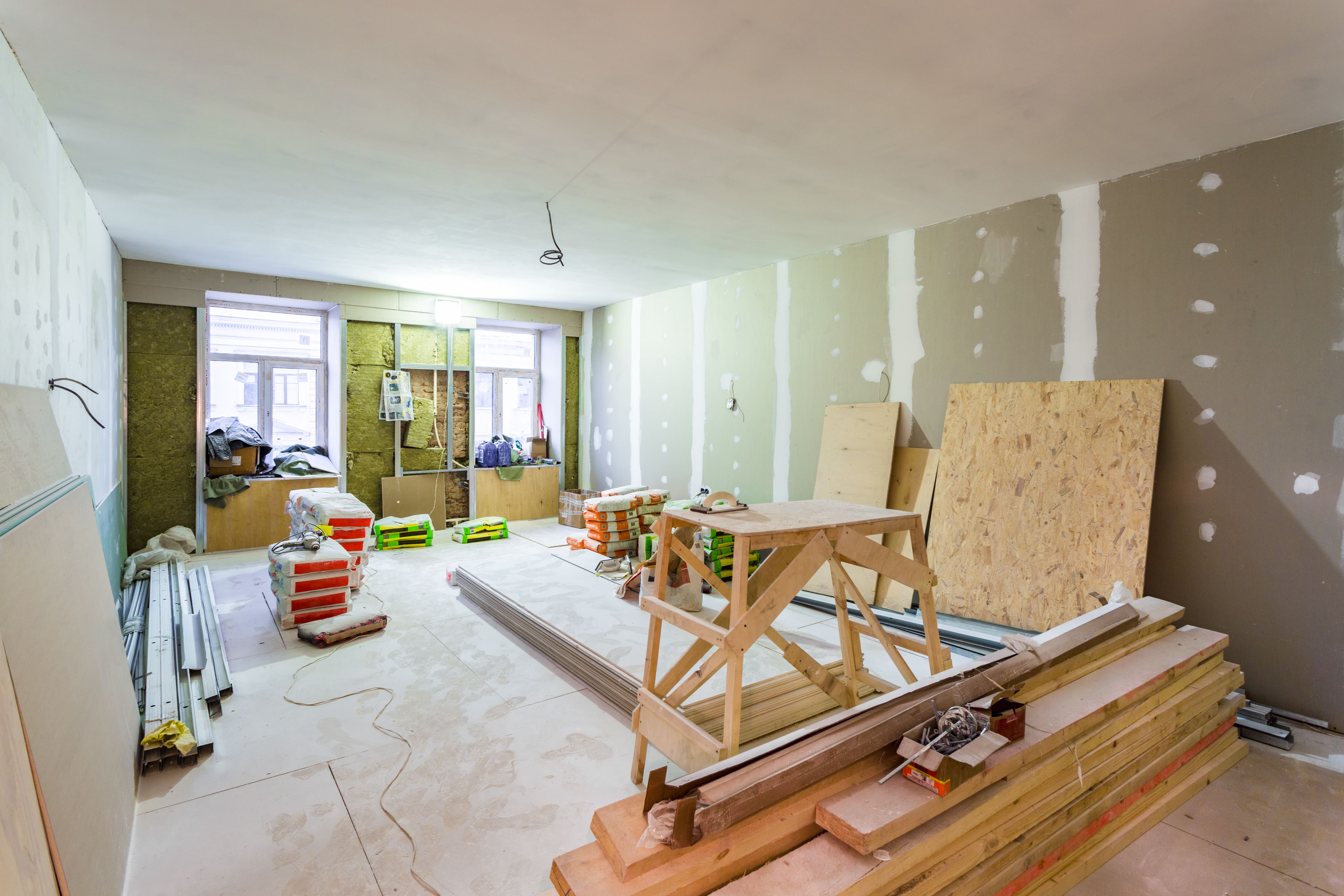 Working process of installing metal frames for plasterboard -drywall - for making gypsum walls  in apartment is under construction, remodeling, renovation, extension, restoration and reconstruction.