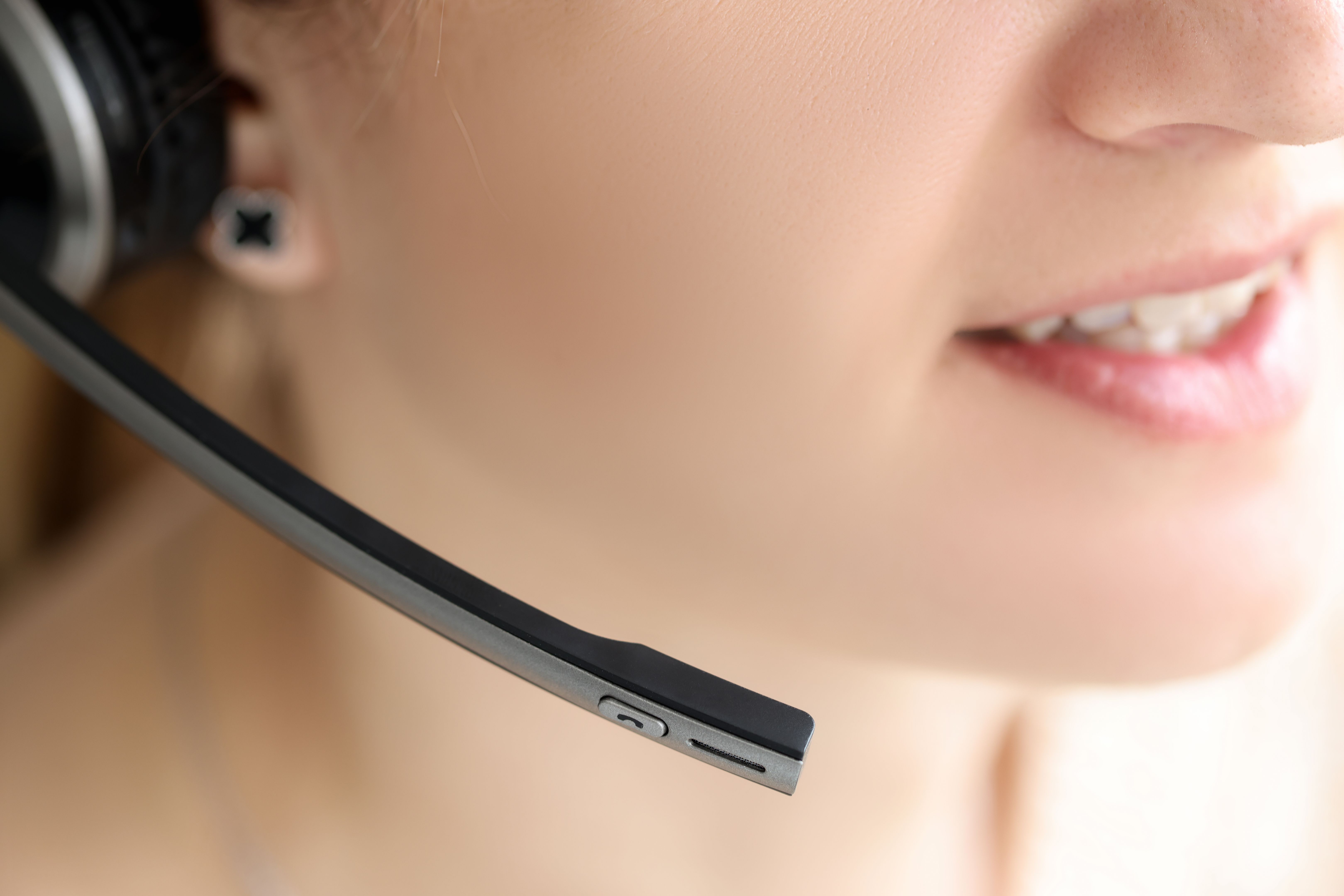 Closeup of black head set on woman head