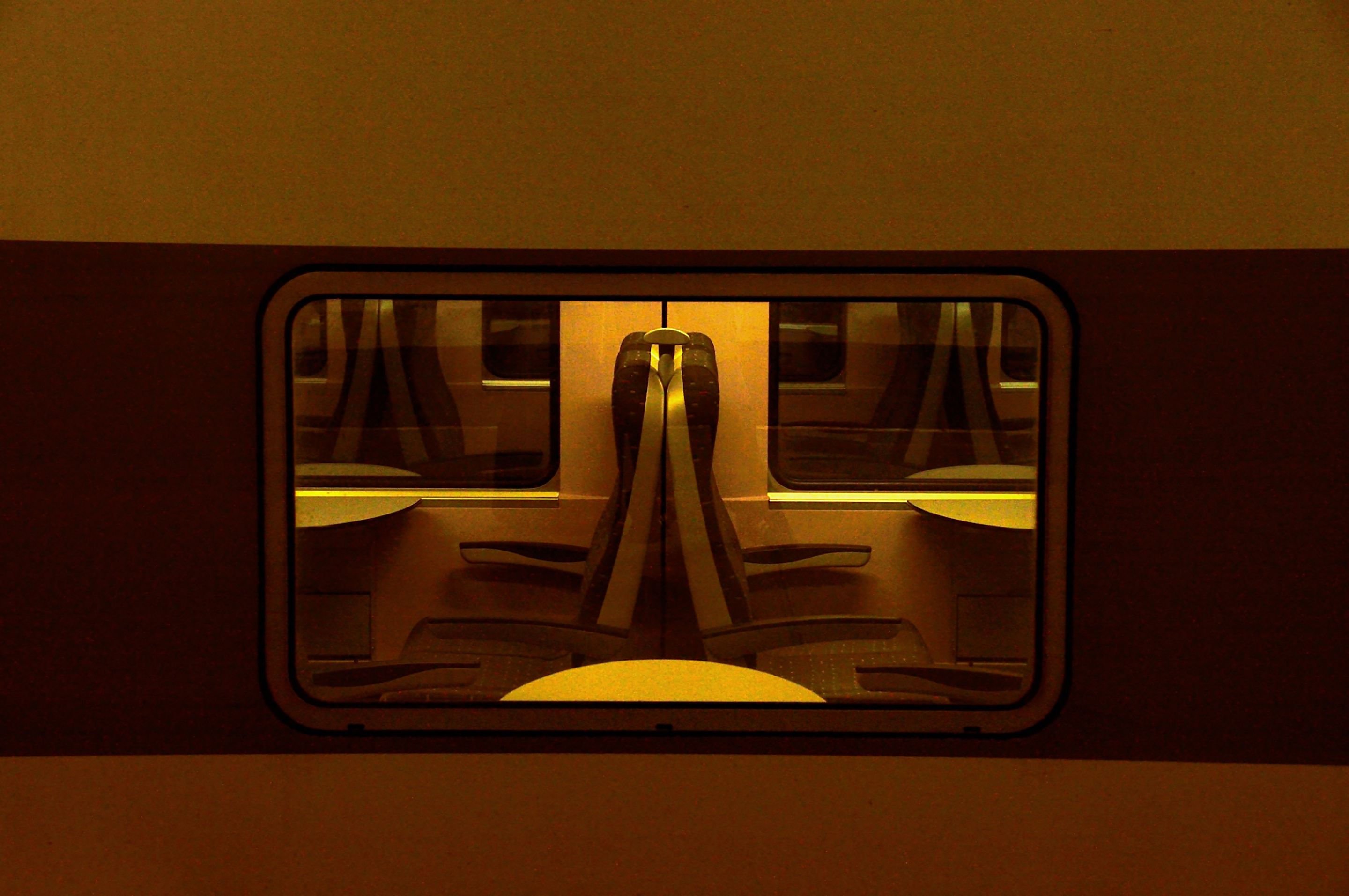 symmetrical train seats seen from the window