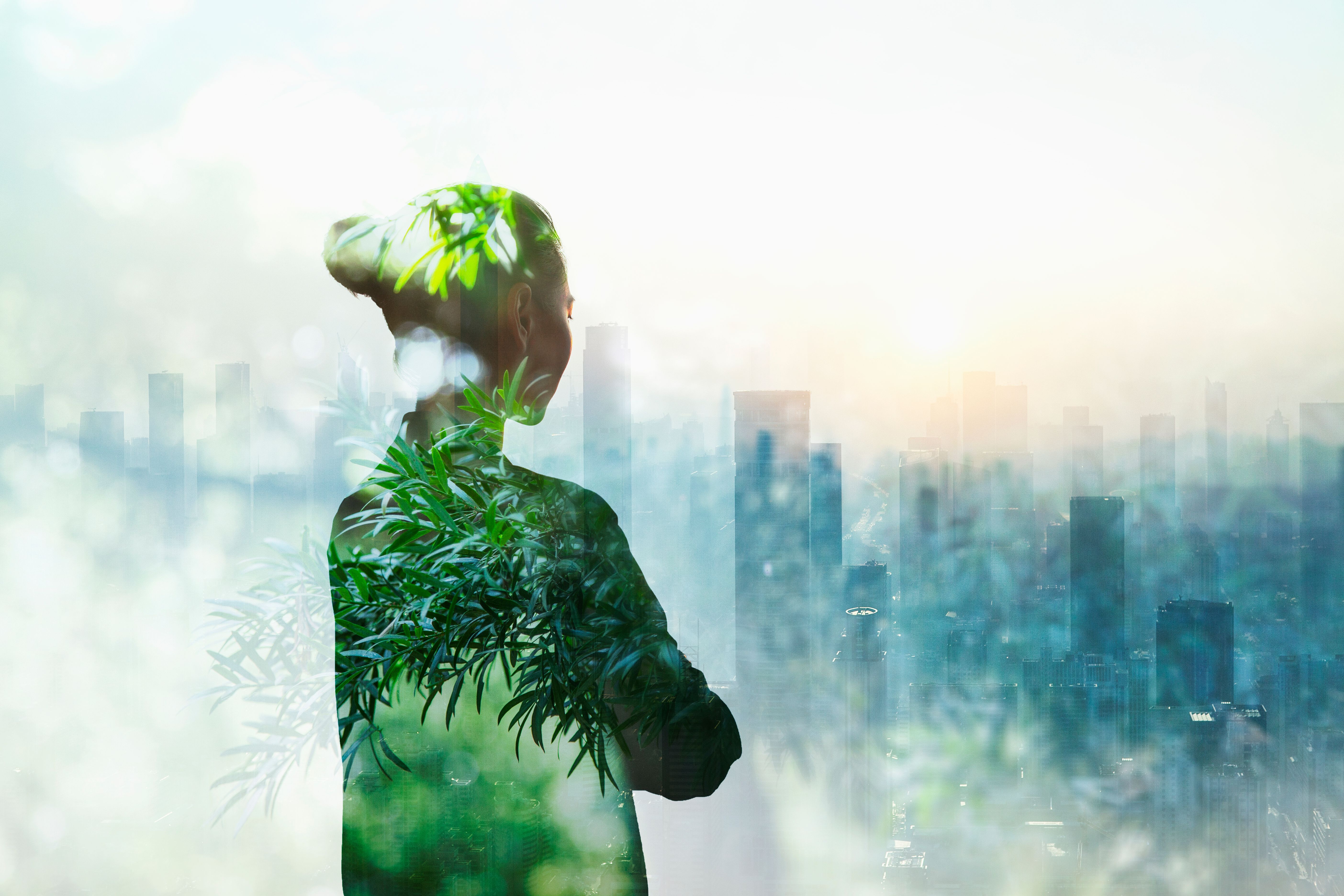 Person standing in contemplation in urban city with nature trees composite Person standing in contemplation in urban city with nature trees composite