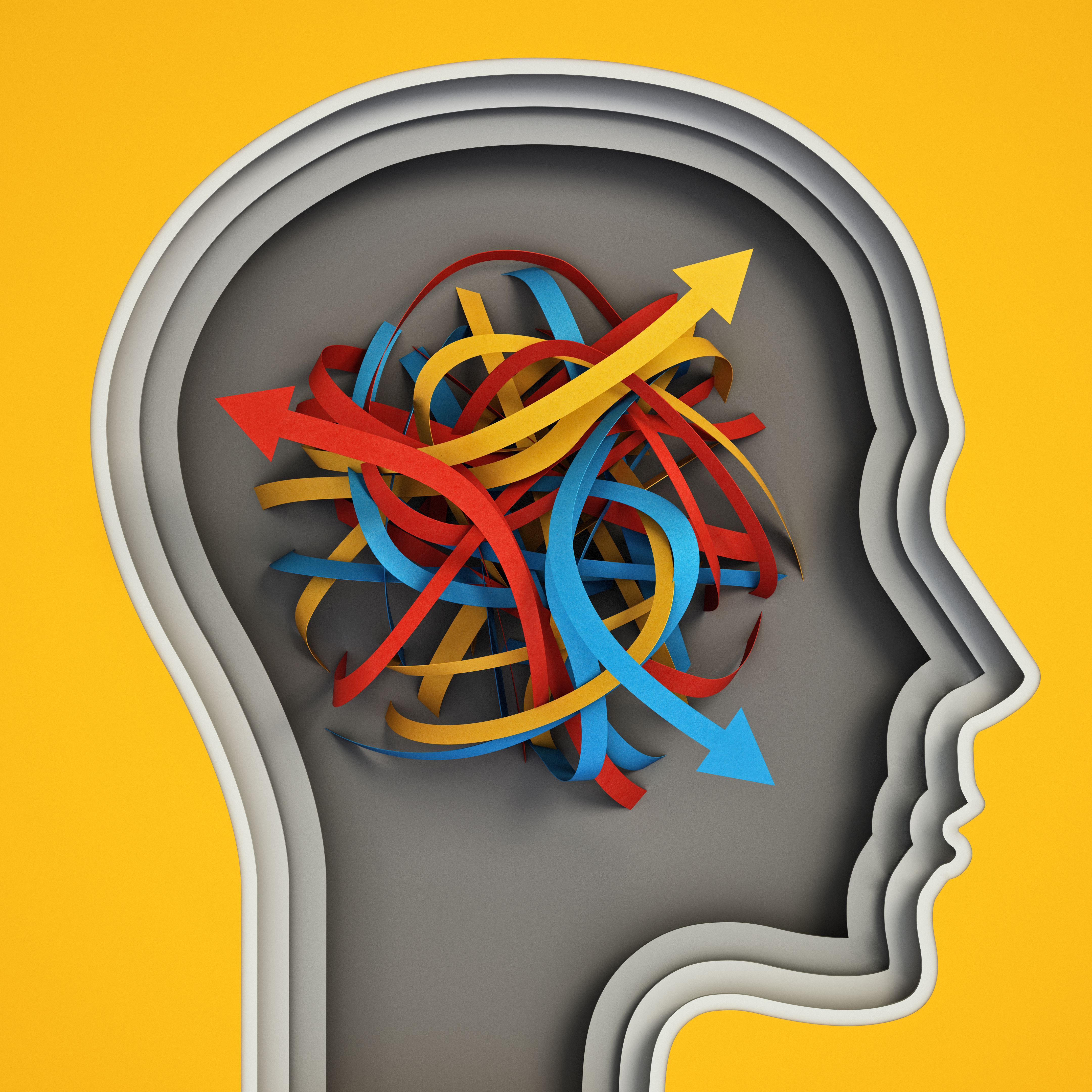 Tangled paper tapes with arrows pointing different ways inside human head shape. Choice and decisions concept Tangled paper tapes with arrows pointing different ways inside human head shape. Choice and decisions concept