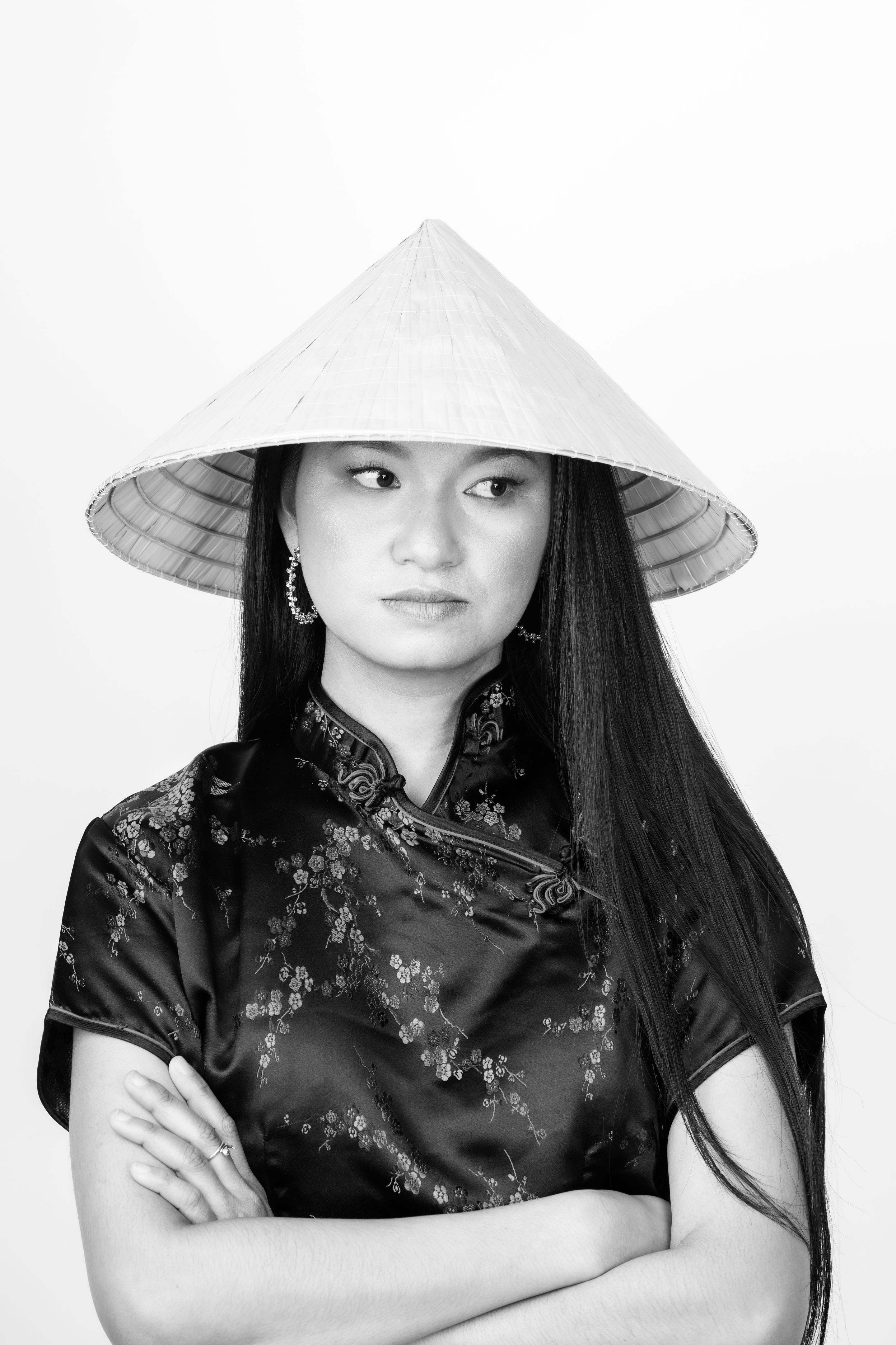 Portrait of Asian woman with cone-shaped Asian cane hat