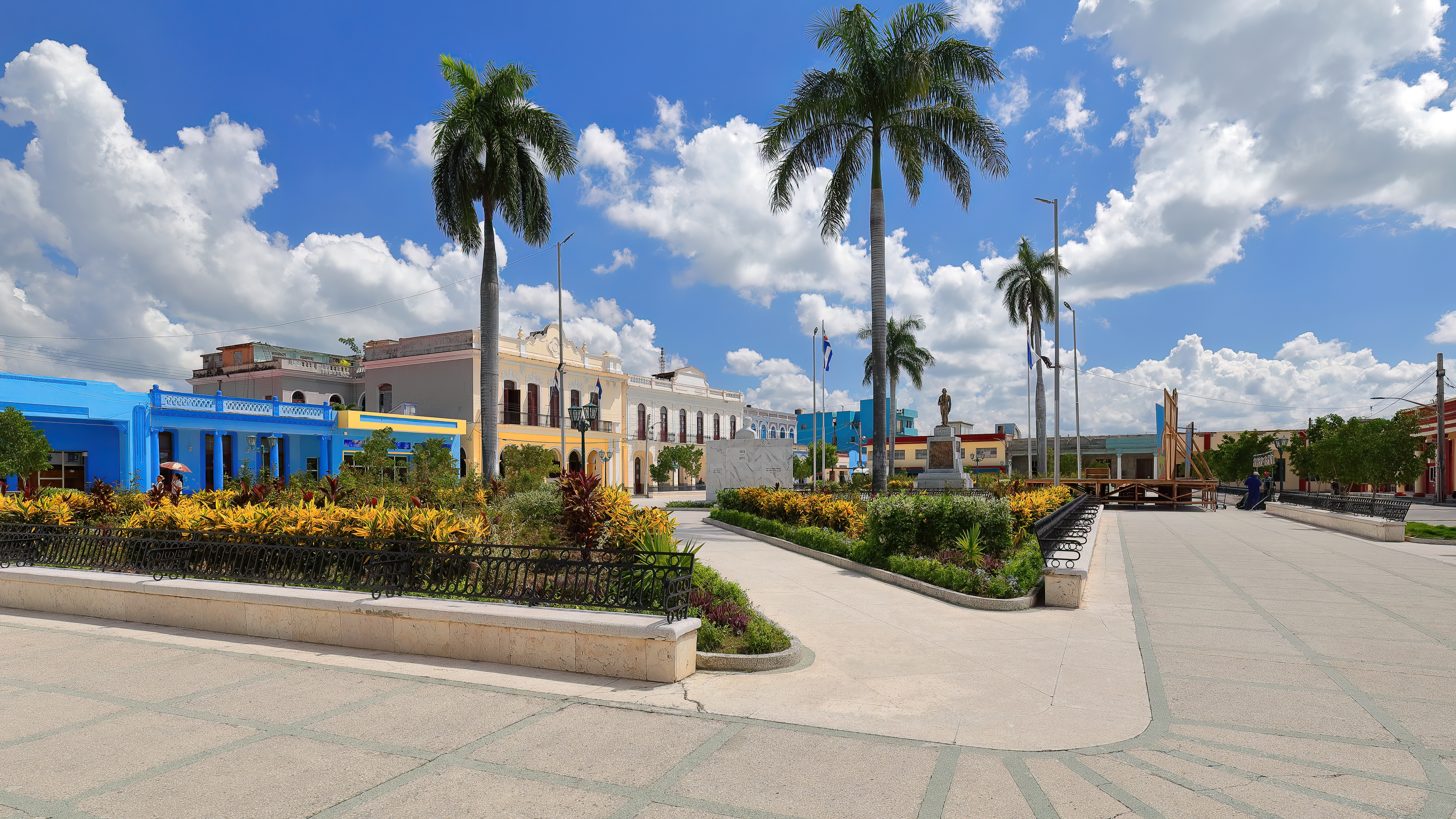 Bronze statue of Carlos Cespedes and marble bust of Perucho Figueredo, among the buildings on the Parque Cespedes Park NE-SE-SW sides. Bayamo-Cuba-373