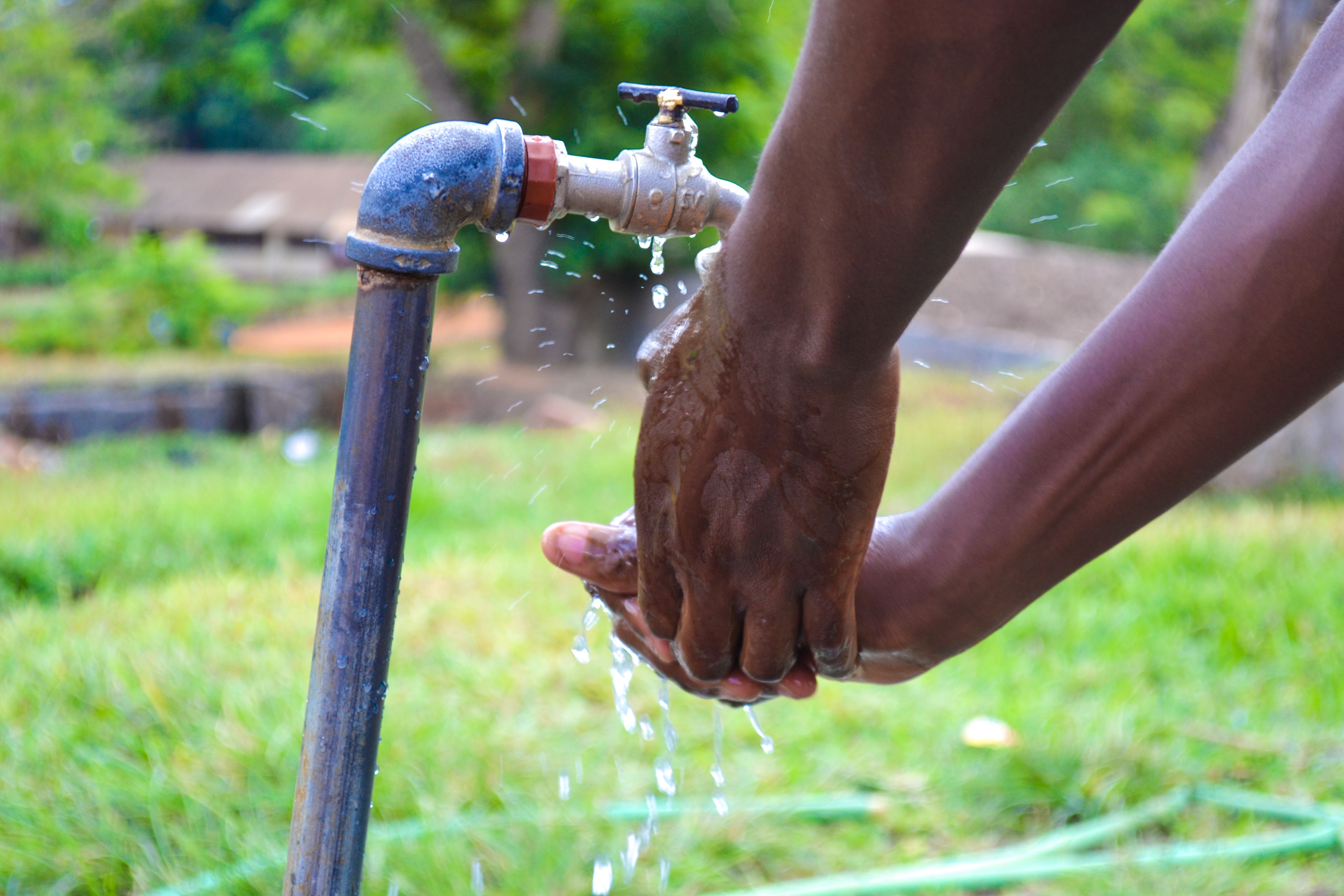 Shot of an unrecognizable man washing his hands.