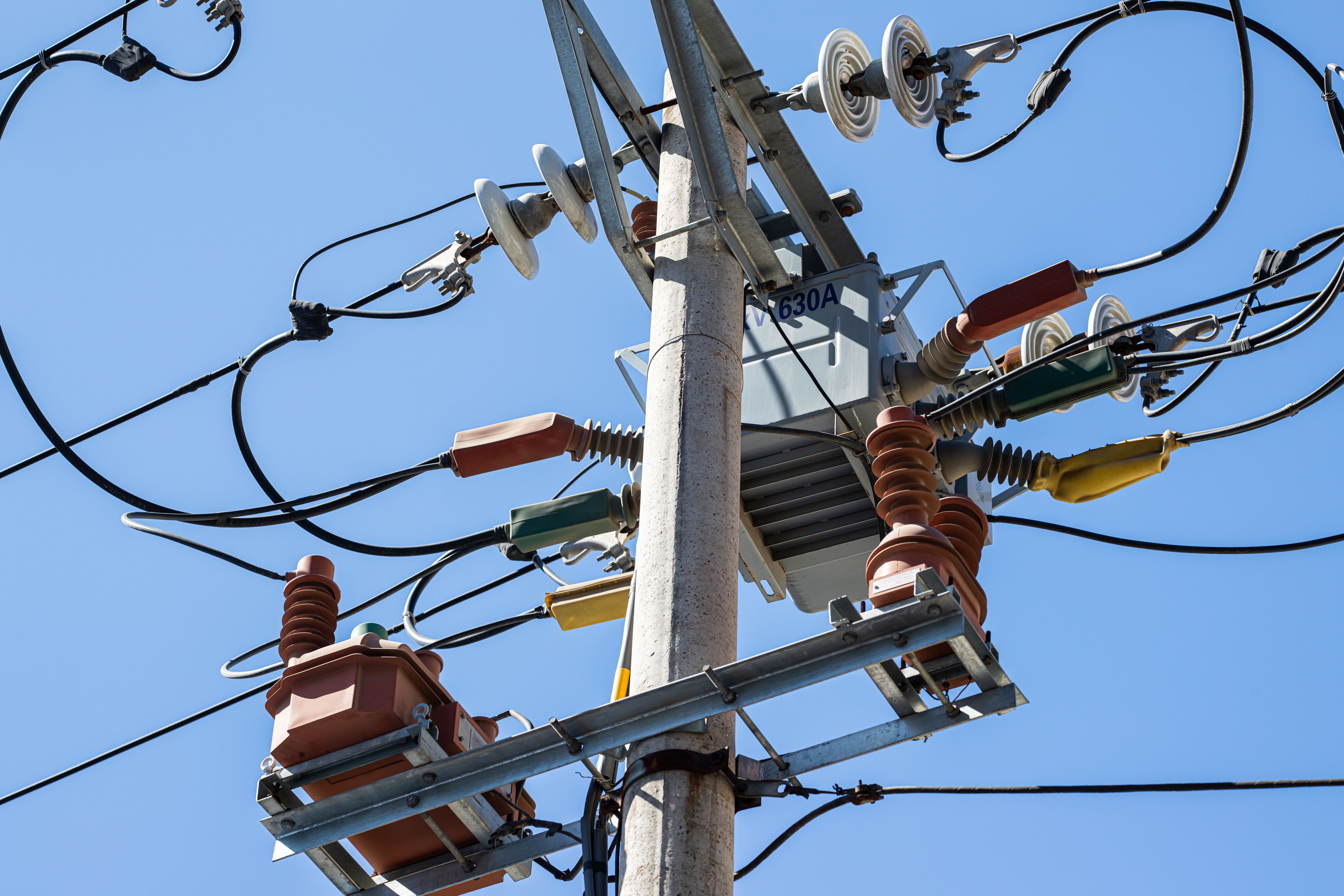 High Voltage Electric Pole with Blue Sky