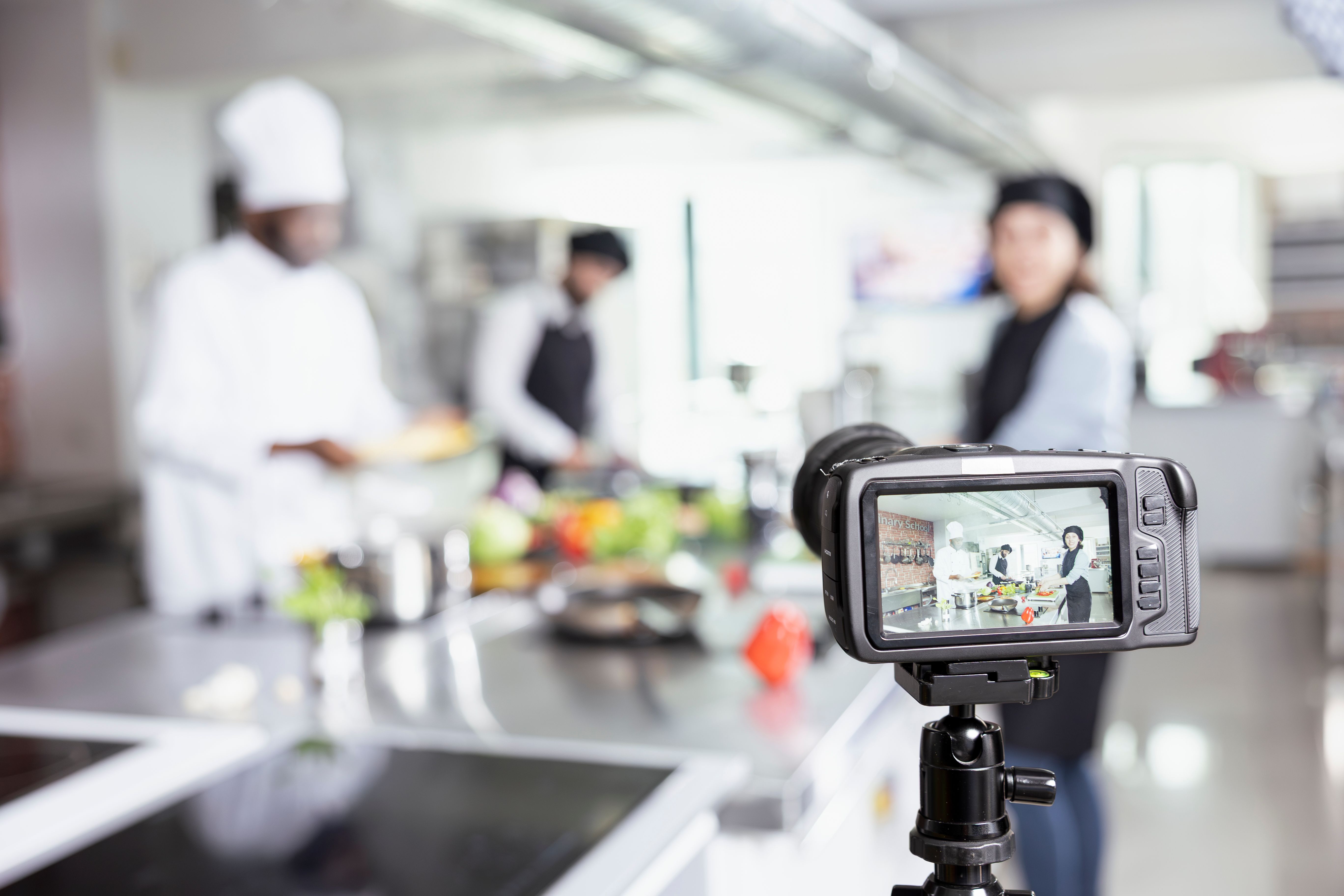 Diverse cooking professionals recording a web master class tutorial