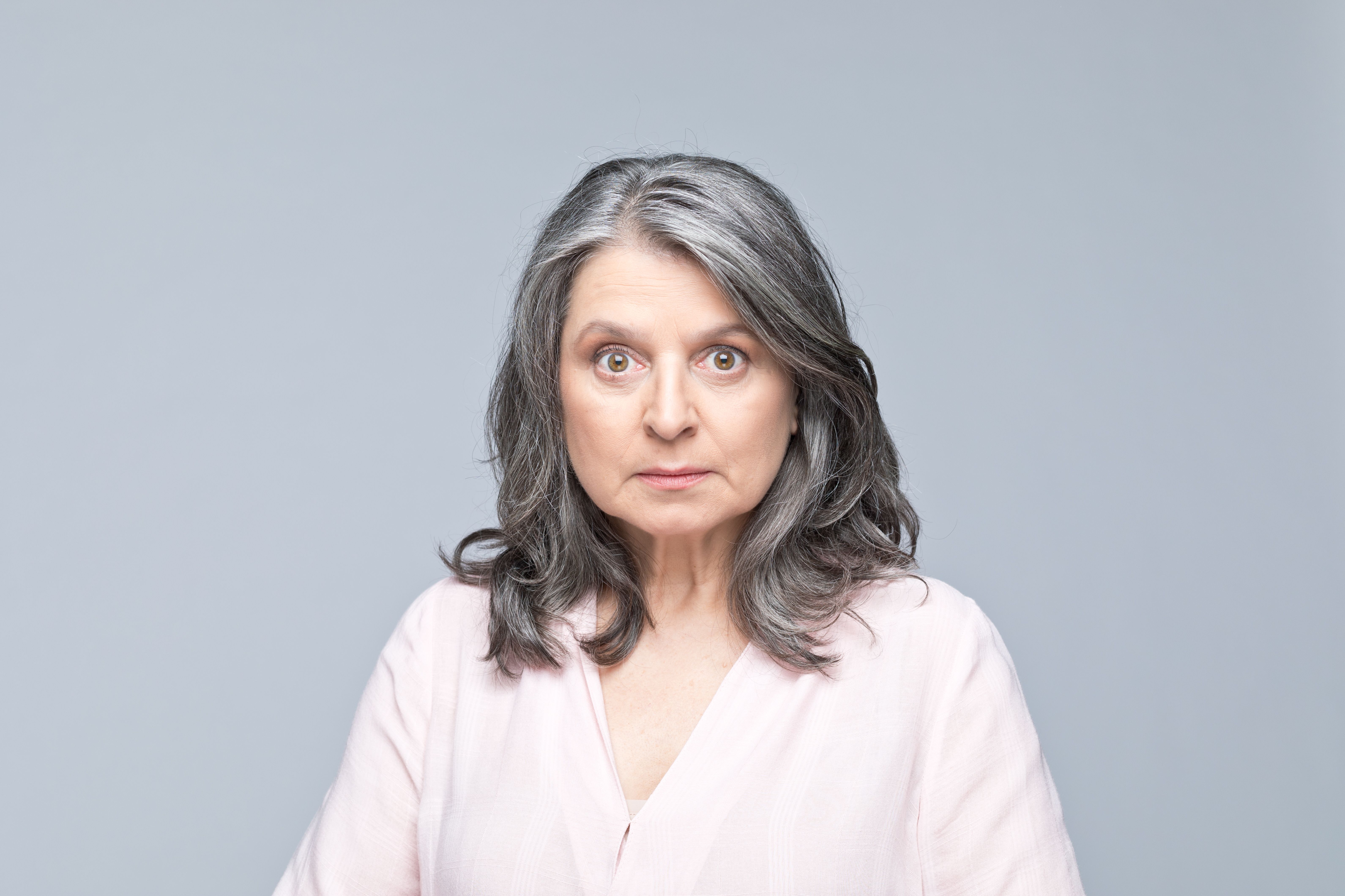 Headshot of shocked mature woman Headshot of shocked mature woman