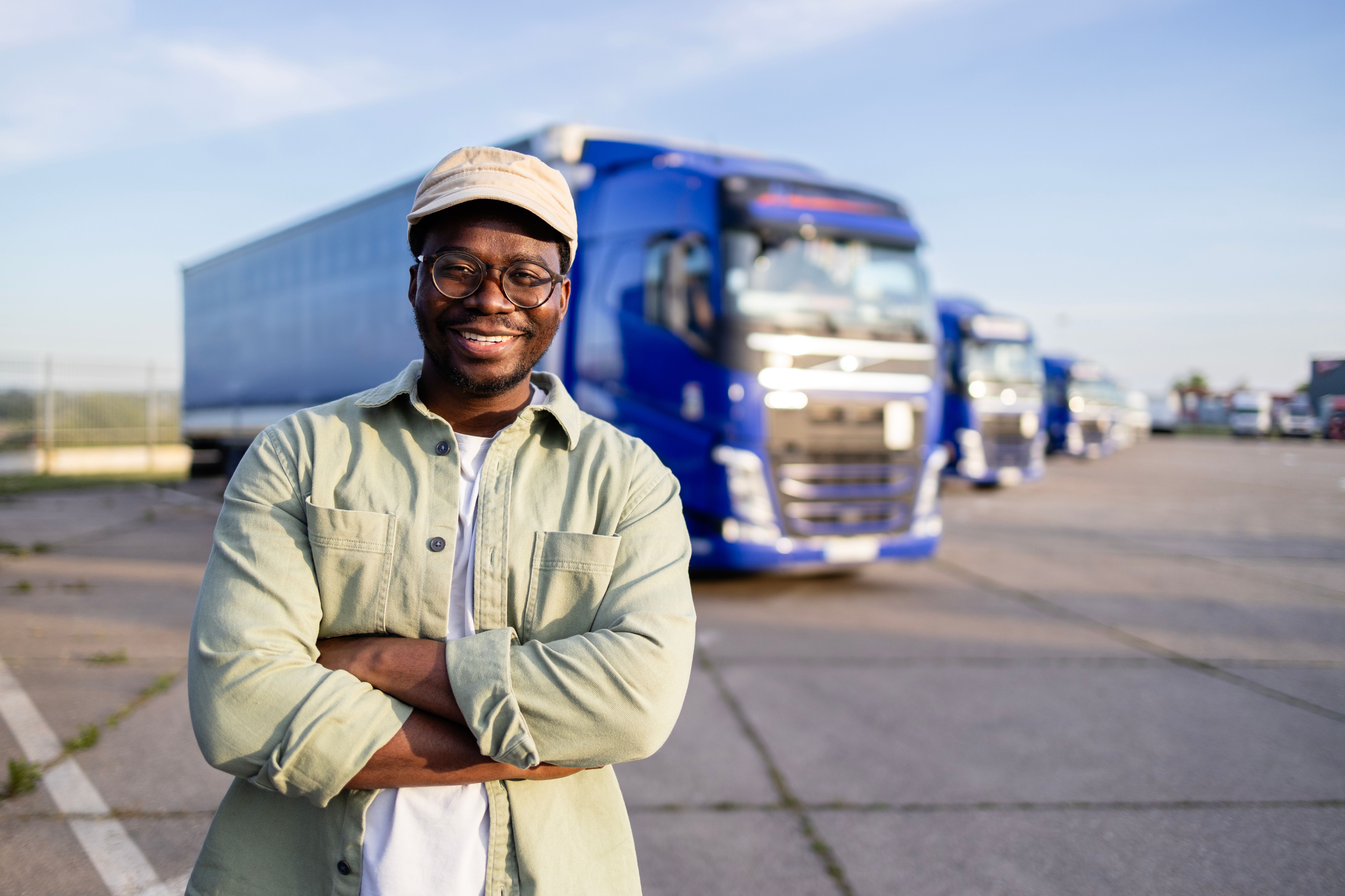 Happy trucker on parking lot.