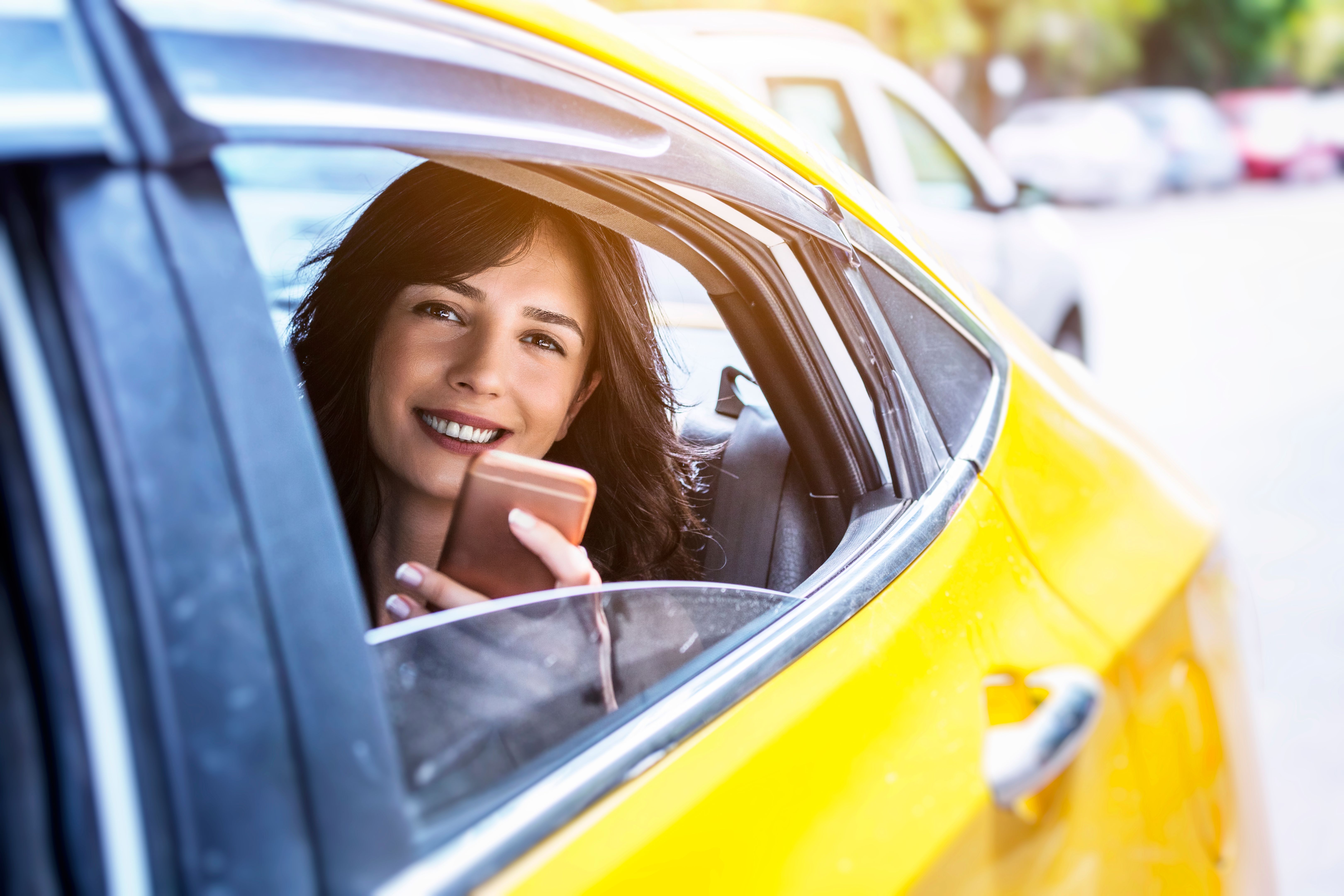 Young woman in taxi Young woman in taxi