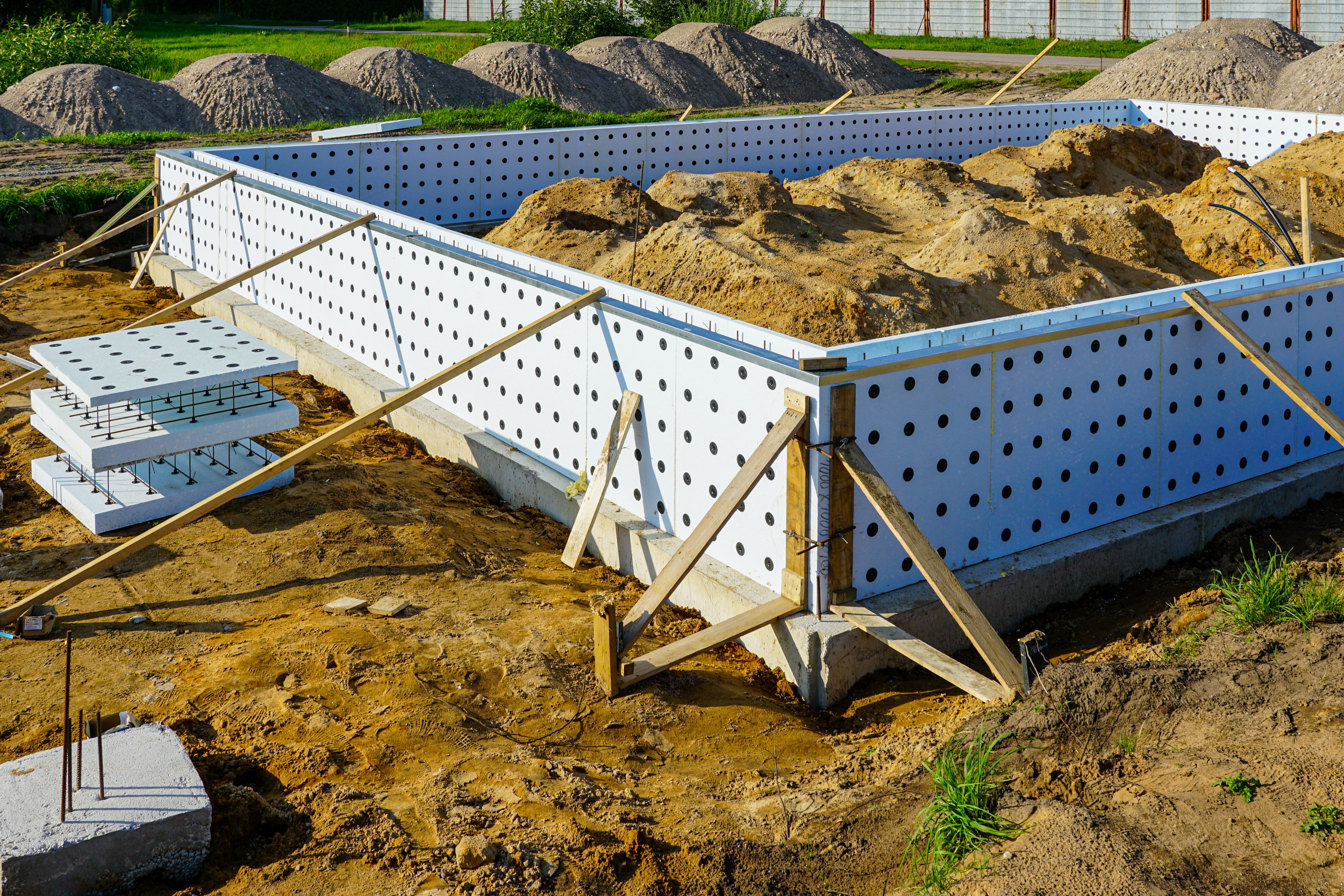 Concrete foundation formwork with insulation panels at residential building site Concrete foundation formwork with insulation panels at residential building site