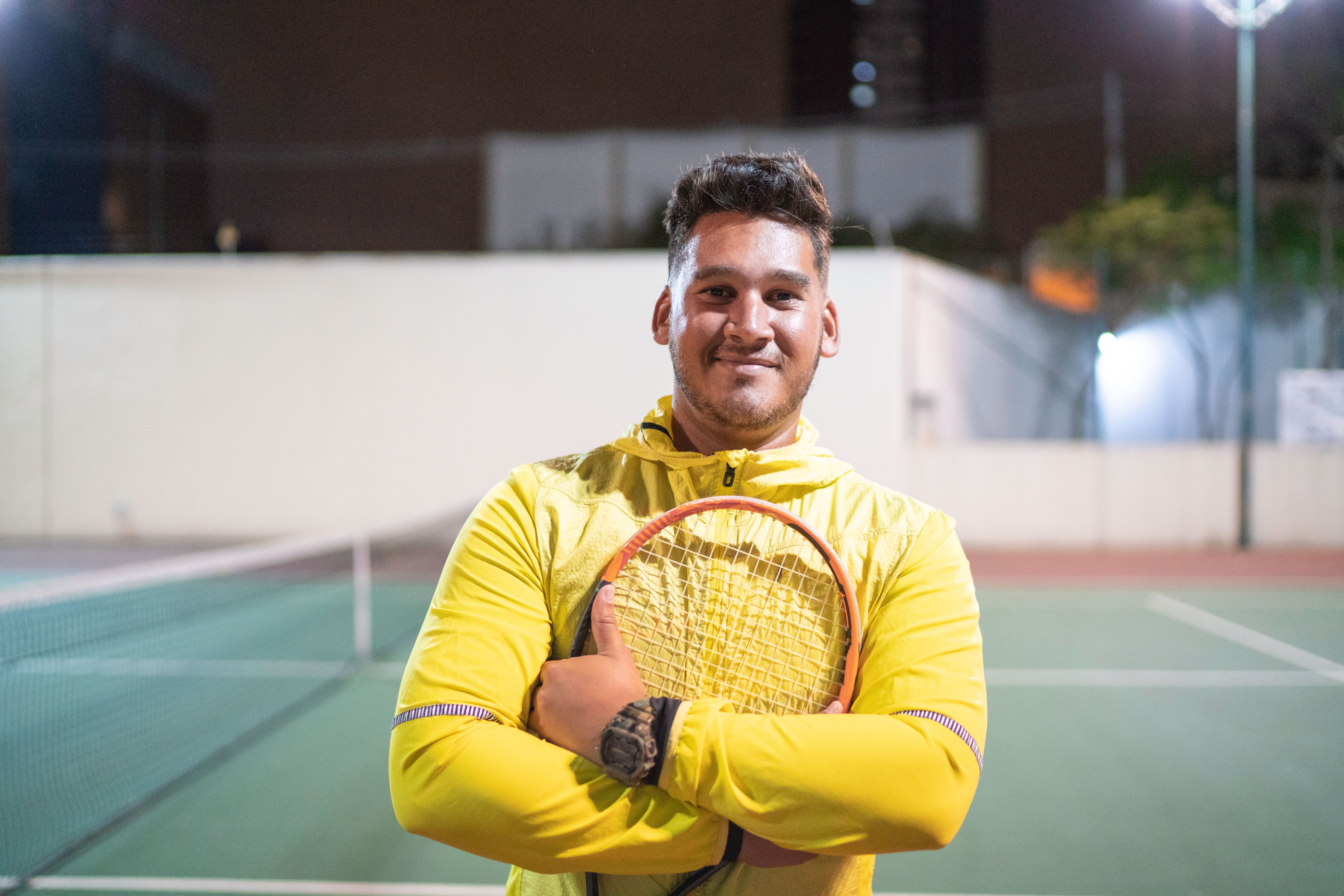 Portrait of a tennis player holding a racket Portrait of a tennis player holding a racket