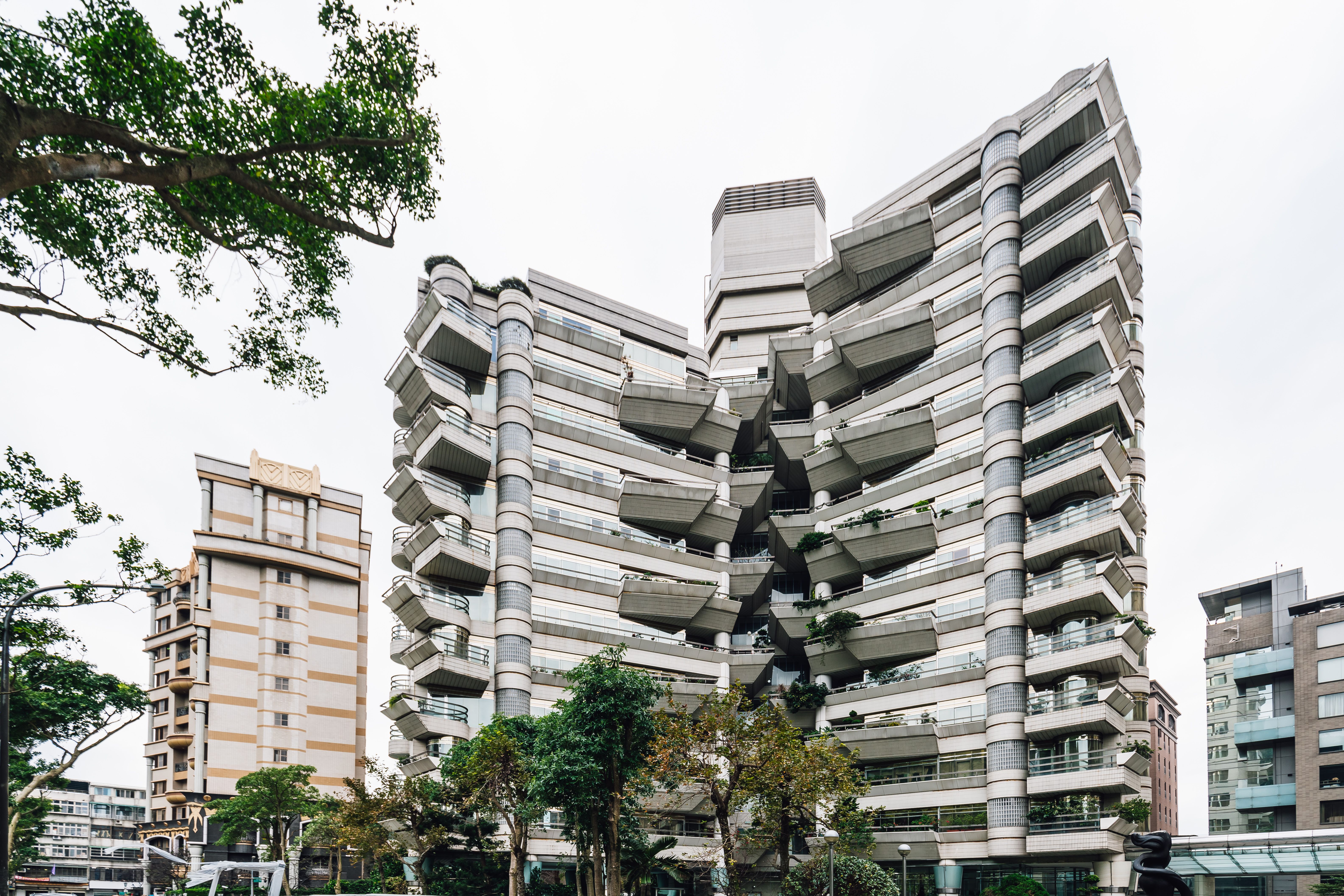 Modern living, Futurist architecture, Real Estate near Xiangshan (Elephant Mountain) in the evening in Taipei, Taiwan.