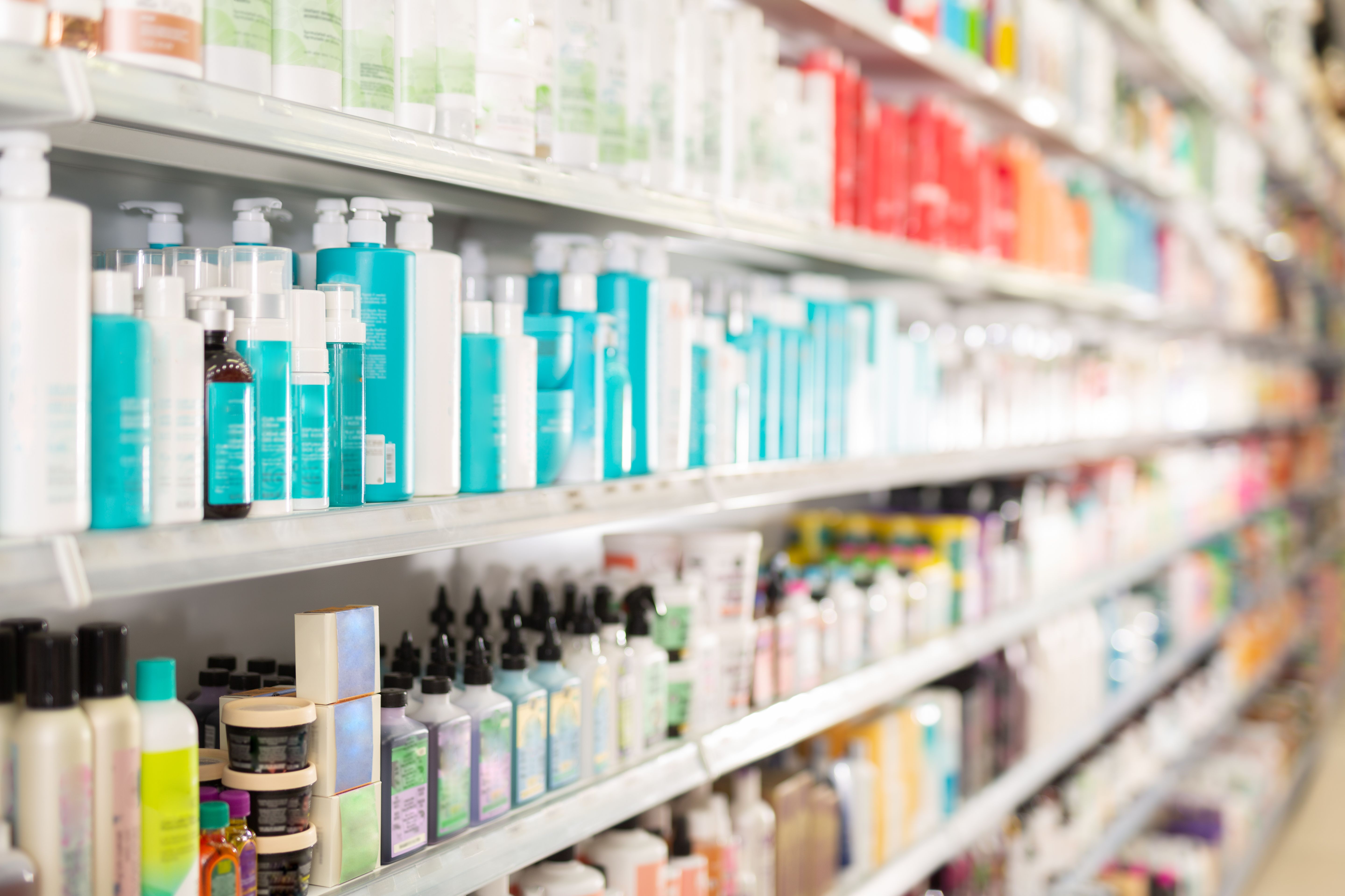 Hair care products on store shelves in supermarket