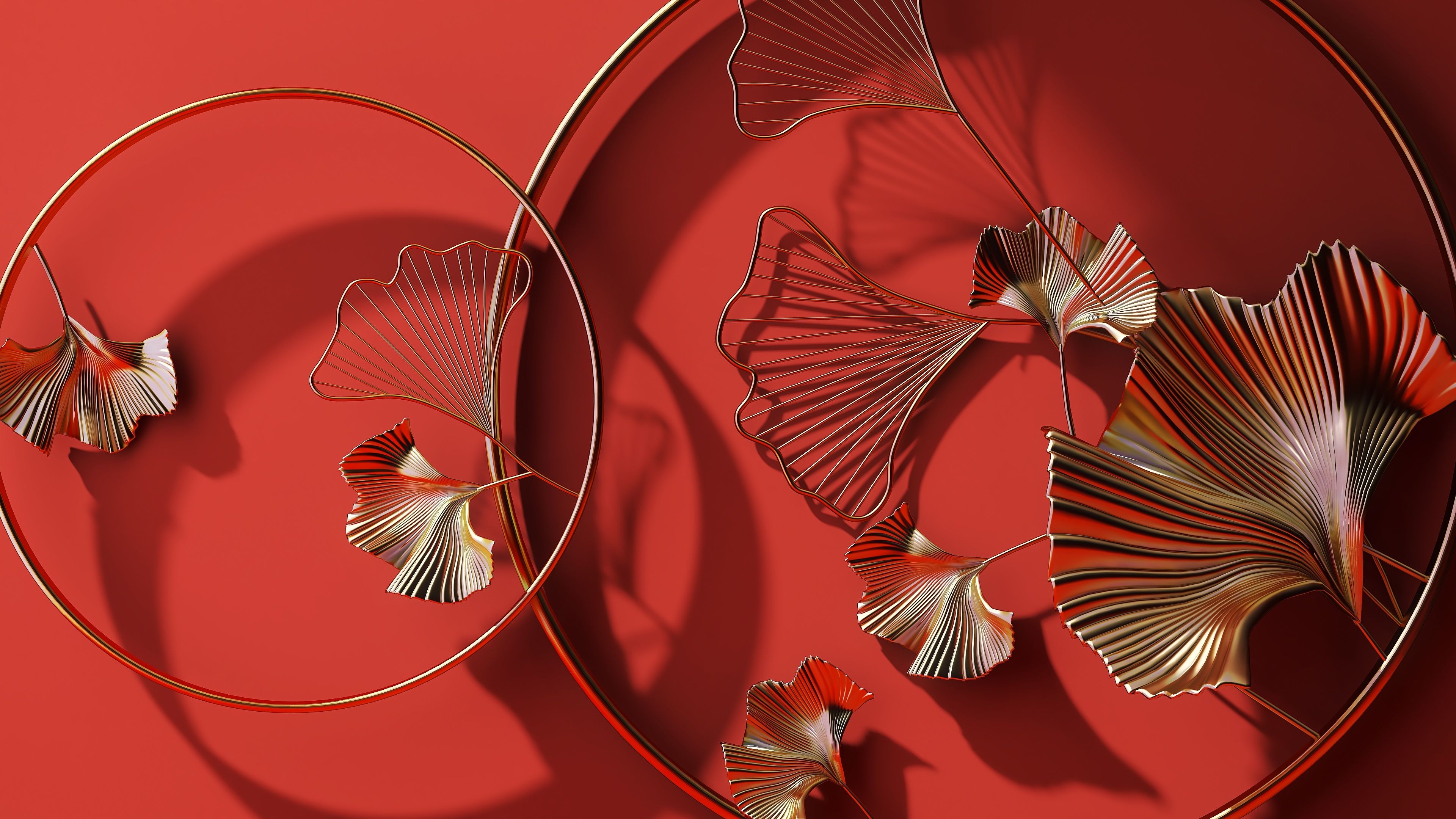 Close up of luxury shiny gold brass metal wall art of Chinese style of ginkgo leaf in circle line as symbol of love and peace on vibrant red wall background