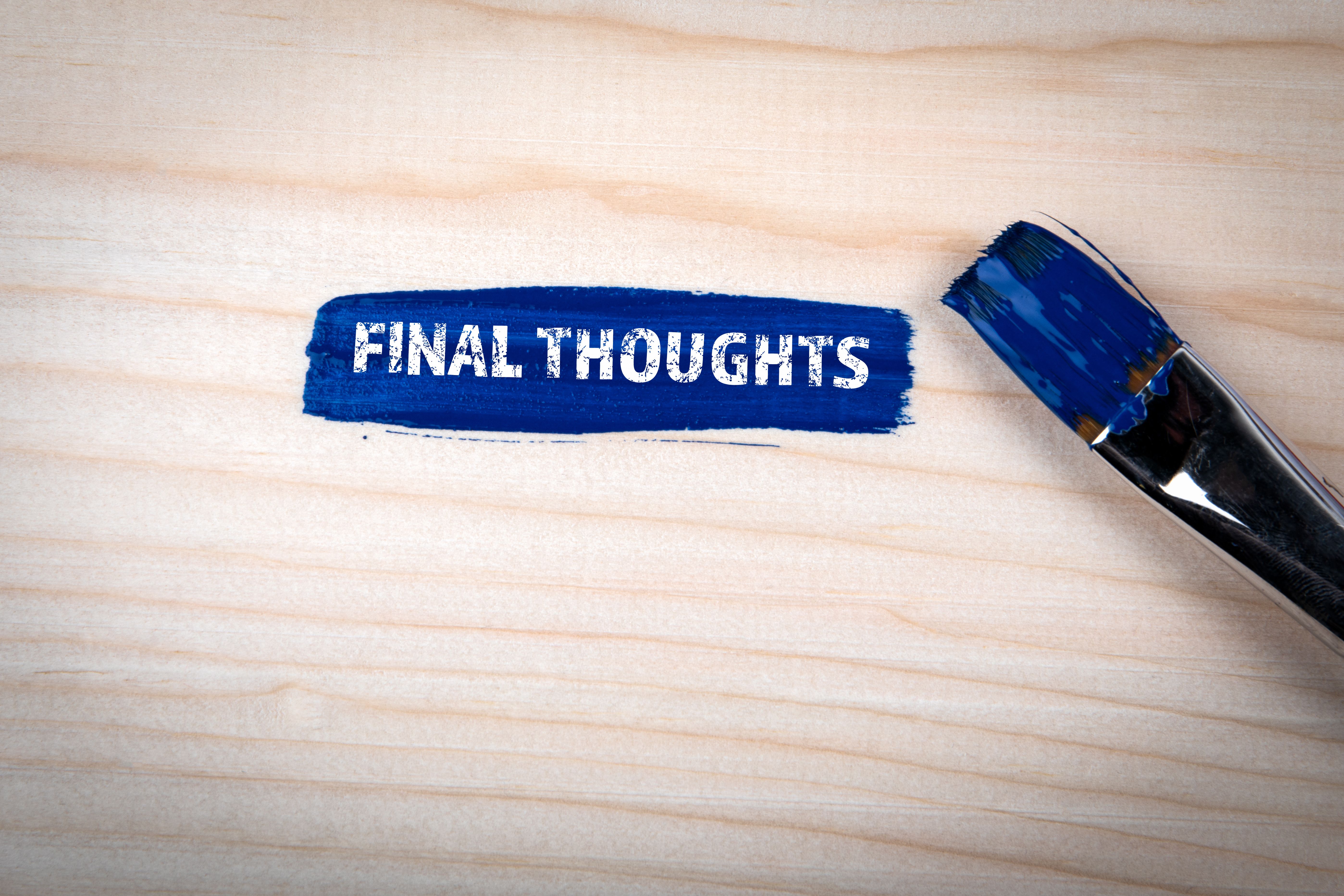 Final Thoughts Concept. Blue paint and paint brush on wooden texture background Final Thoughts Concept. Blue paint and paint brush on wooden texture background