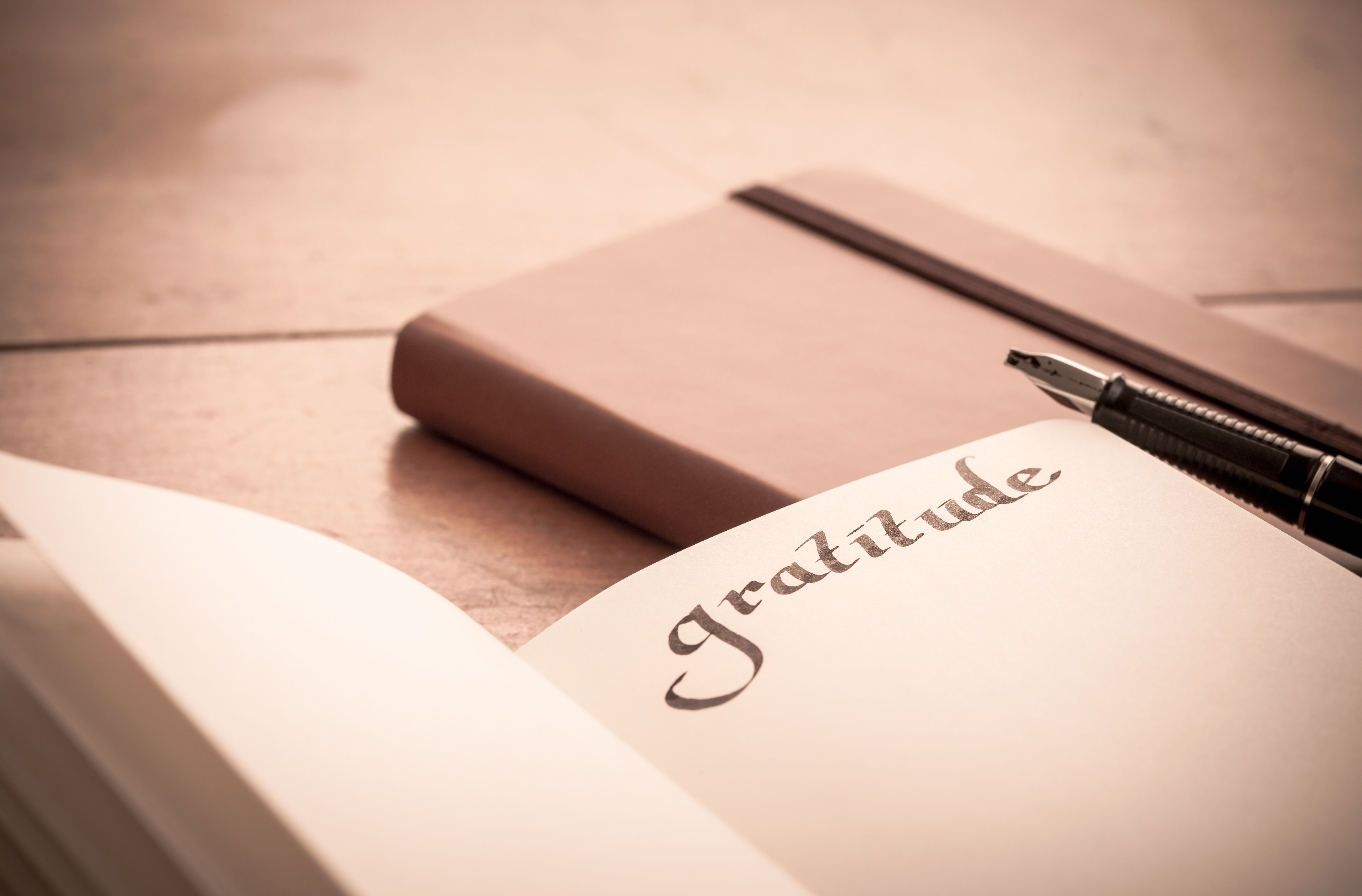Notebook on Wooden Table - Gratitude Journal