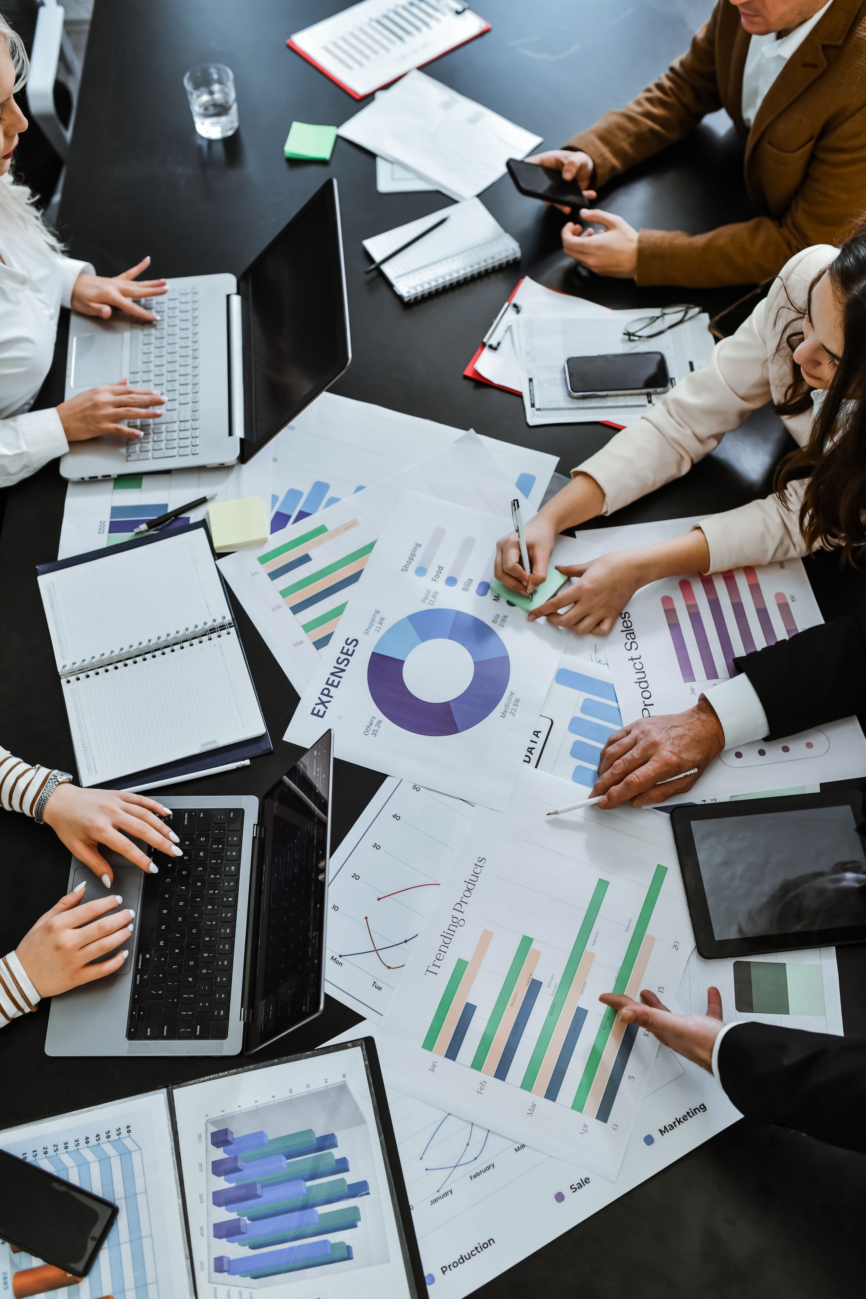 Conference Table Covered in Documents and Paperwork While Employees Are Having Busy Work Day Conference Table Covered in Documents and Paperwork While Employees Are Having Busy Work Day