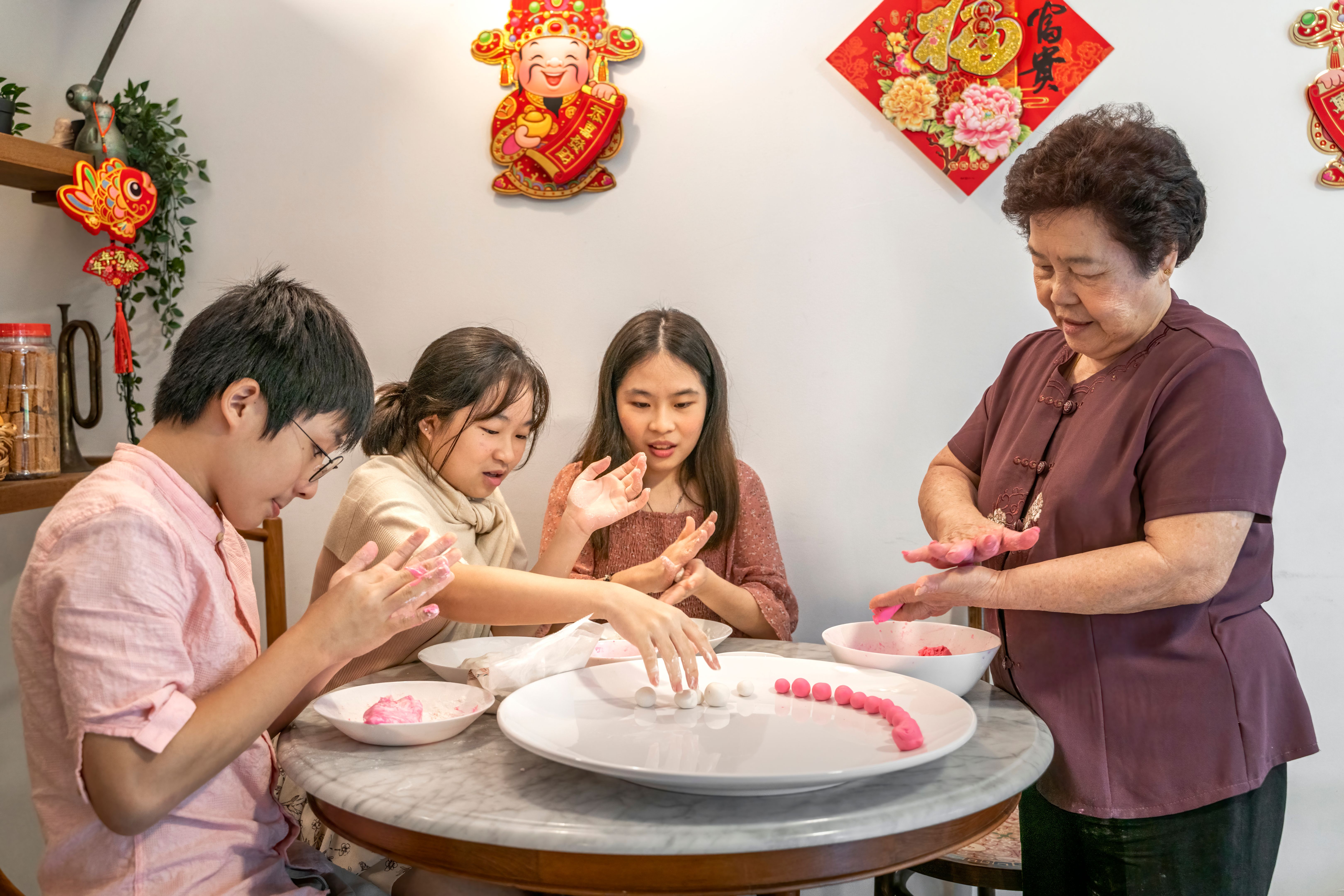family making dumplings