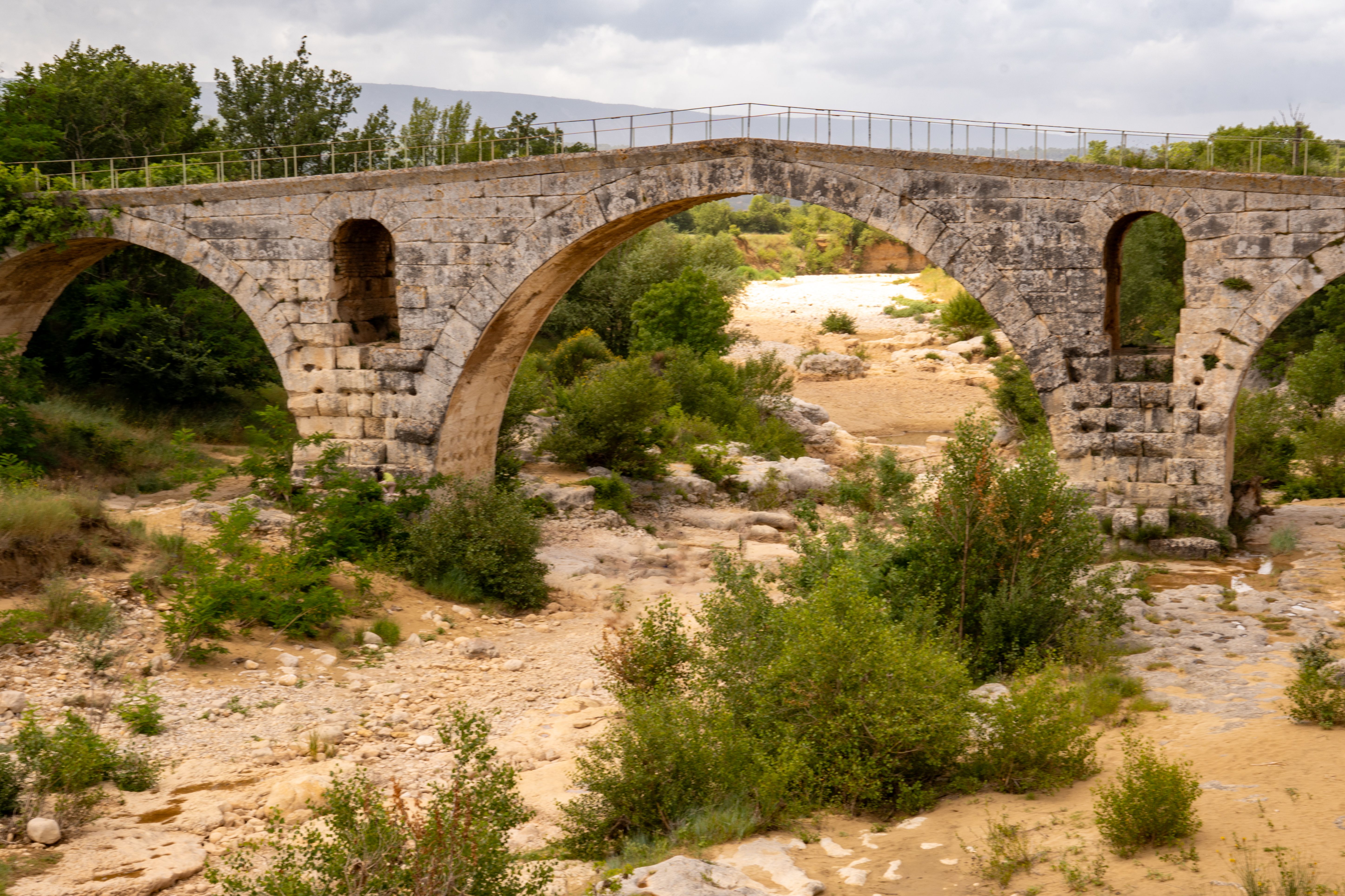 The Pont Julien, famous Roman bridge in Bonnieux, Luberon, France, dates back 2000 years. It spans the Calavon River in three arches