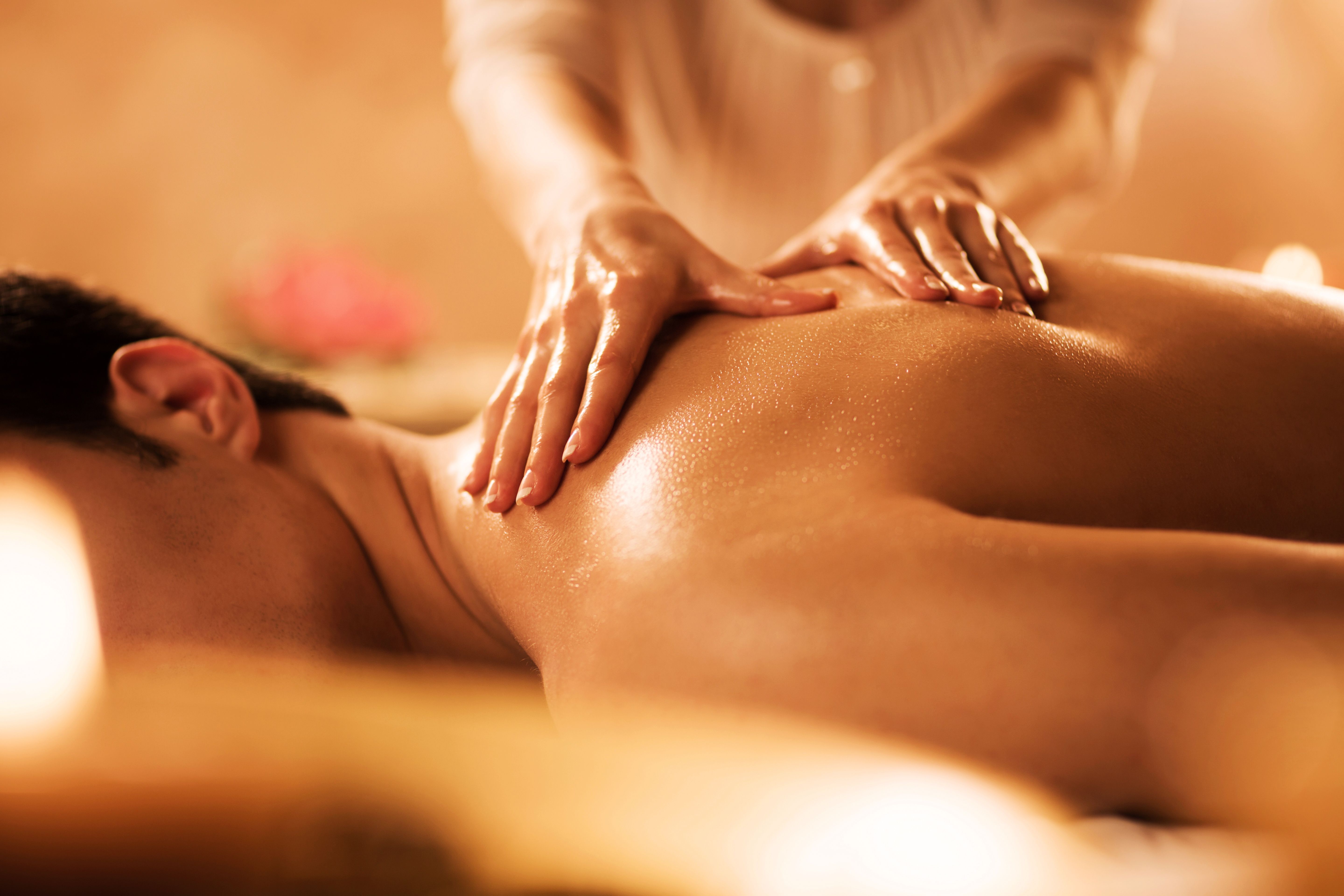 Unrecognizable man receiving massage at the spa.