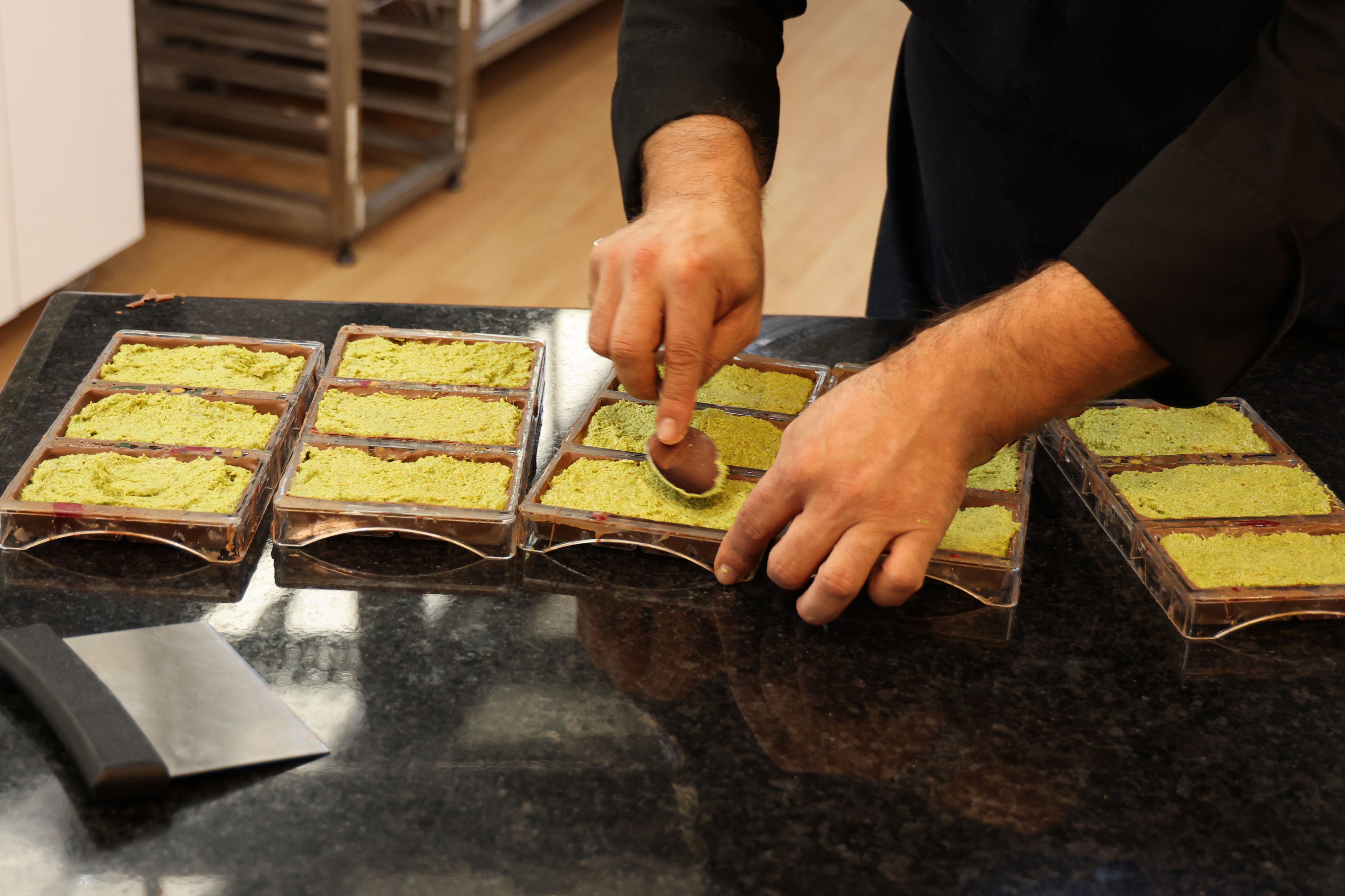 Chef prepares Dubai chocolate in his kitchen