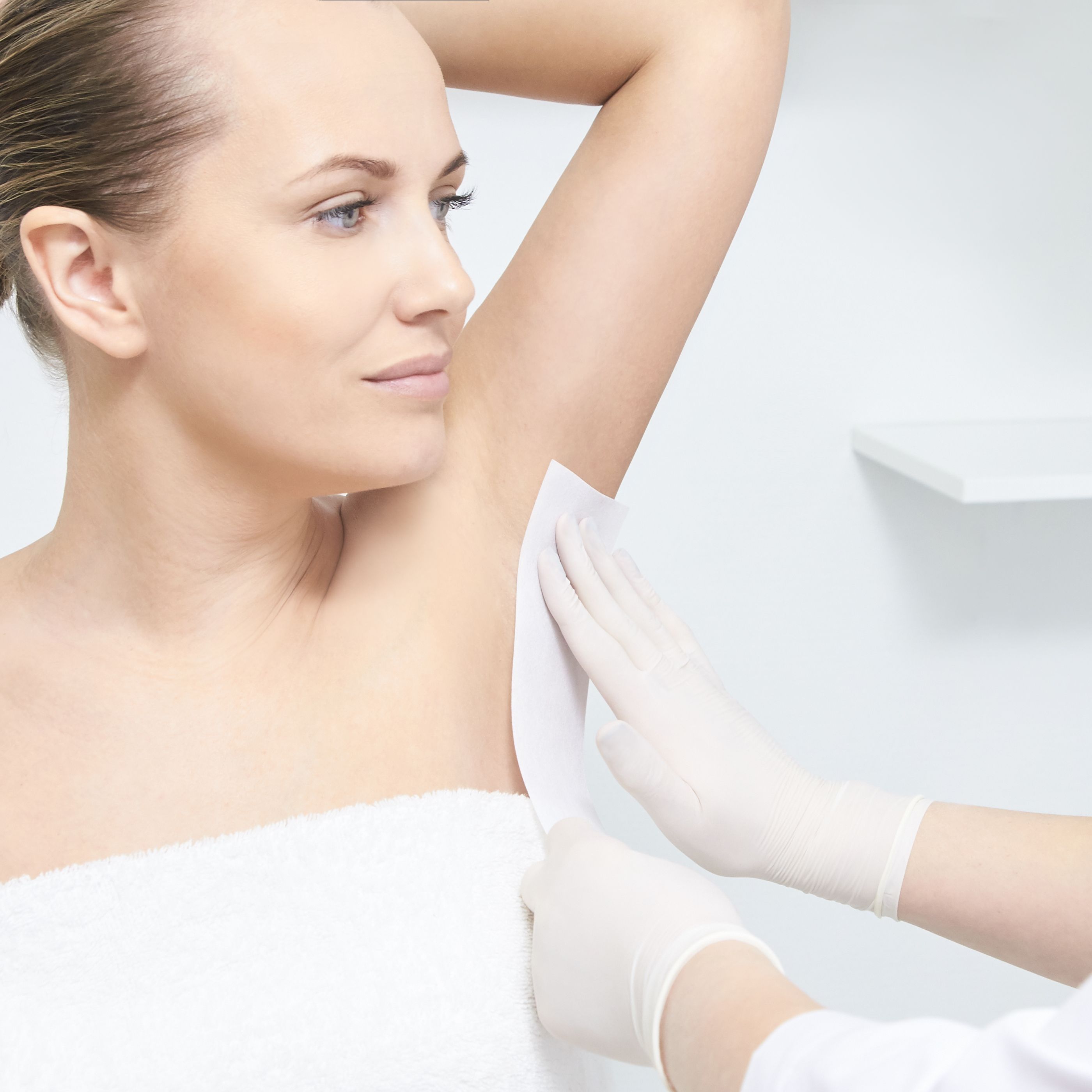 Unwanted hair wax epilation. Young Woman. cosmetology salon treatment procedure. Home waxing