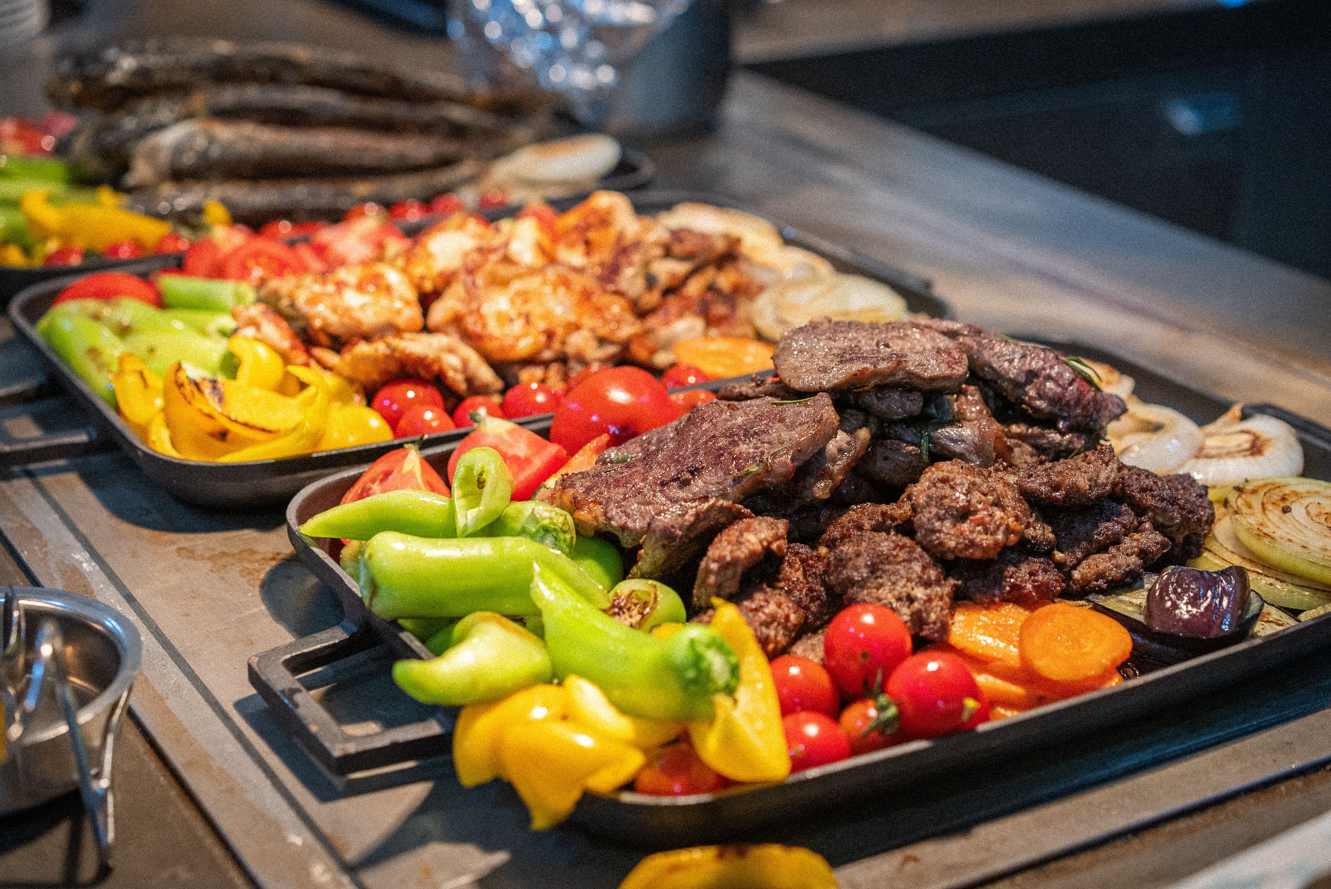 Grilled meat and vegetables at the buffet