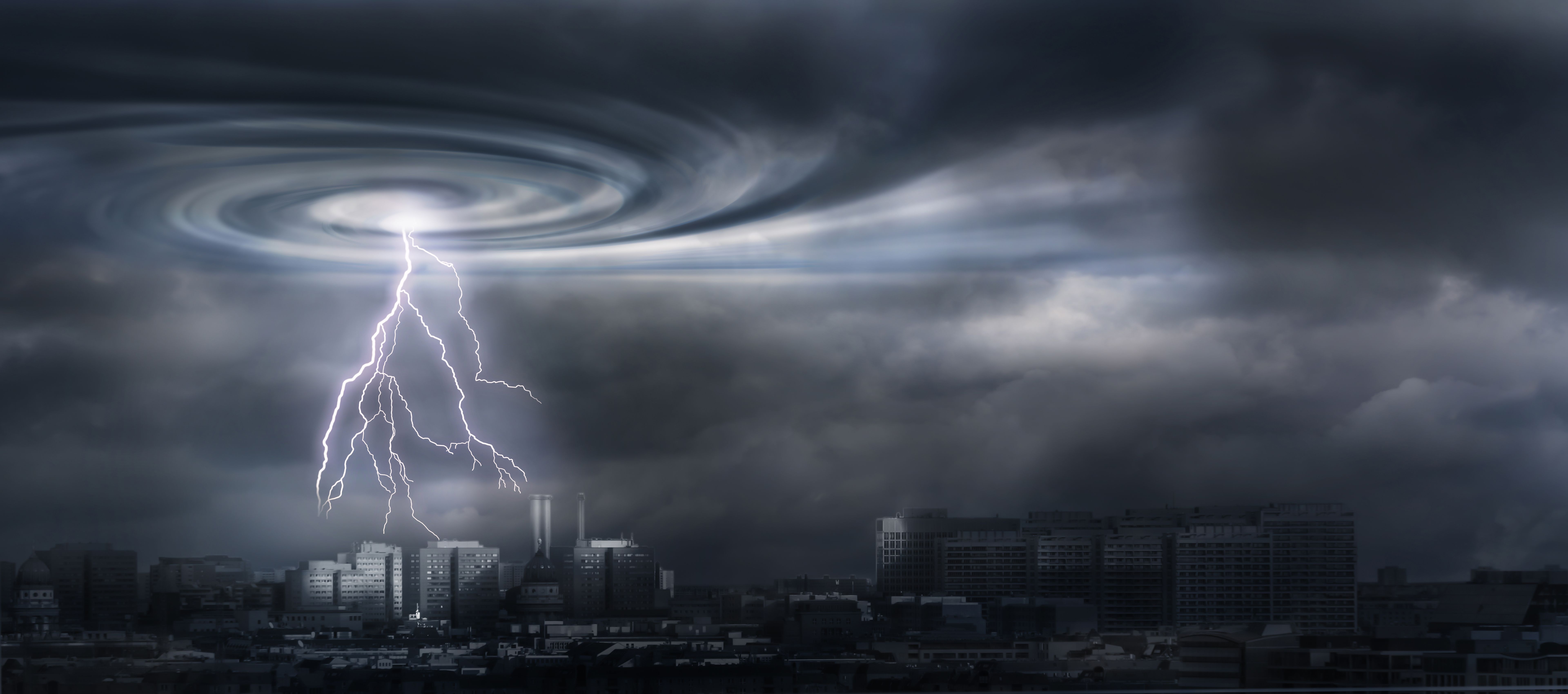 dark city silhouette in the eye of the storm, lightning on black cyclone sky background, symbolic concept for blackout, financial crash, climate change or other disasters