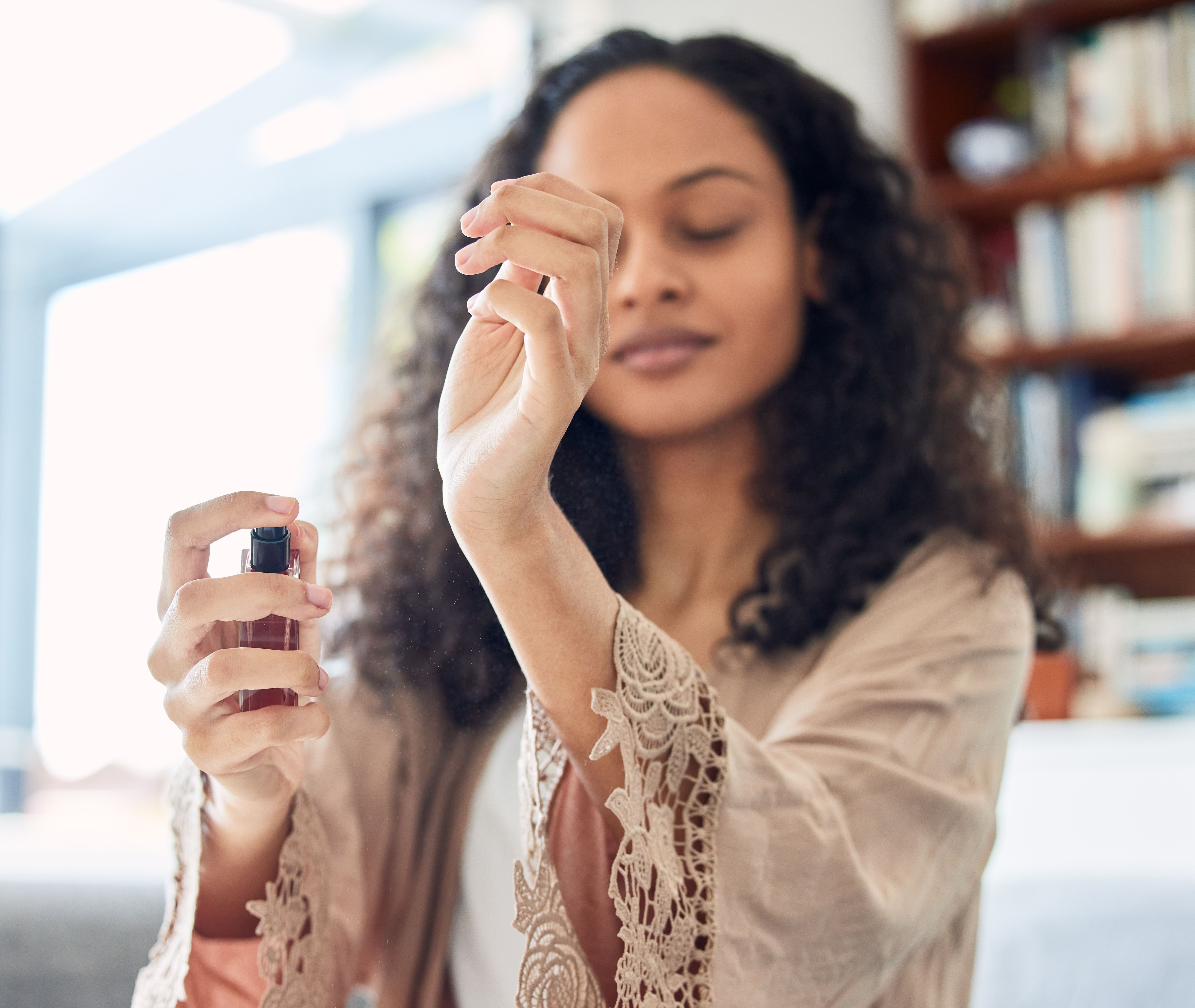 woman smelling perfume