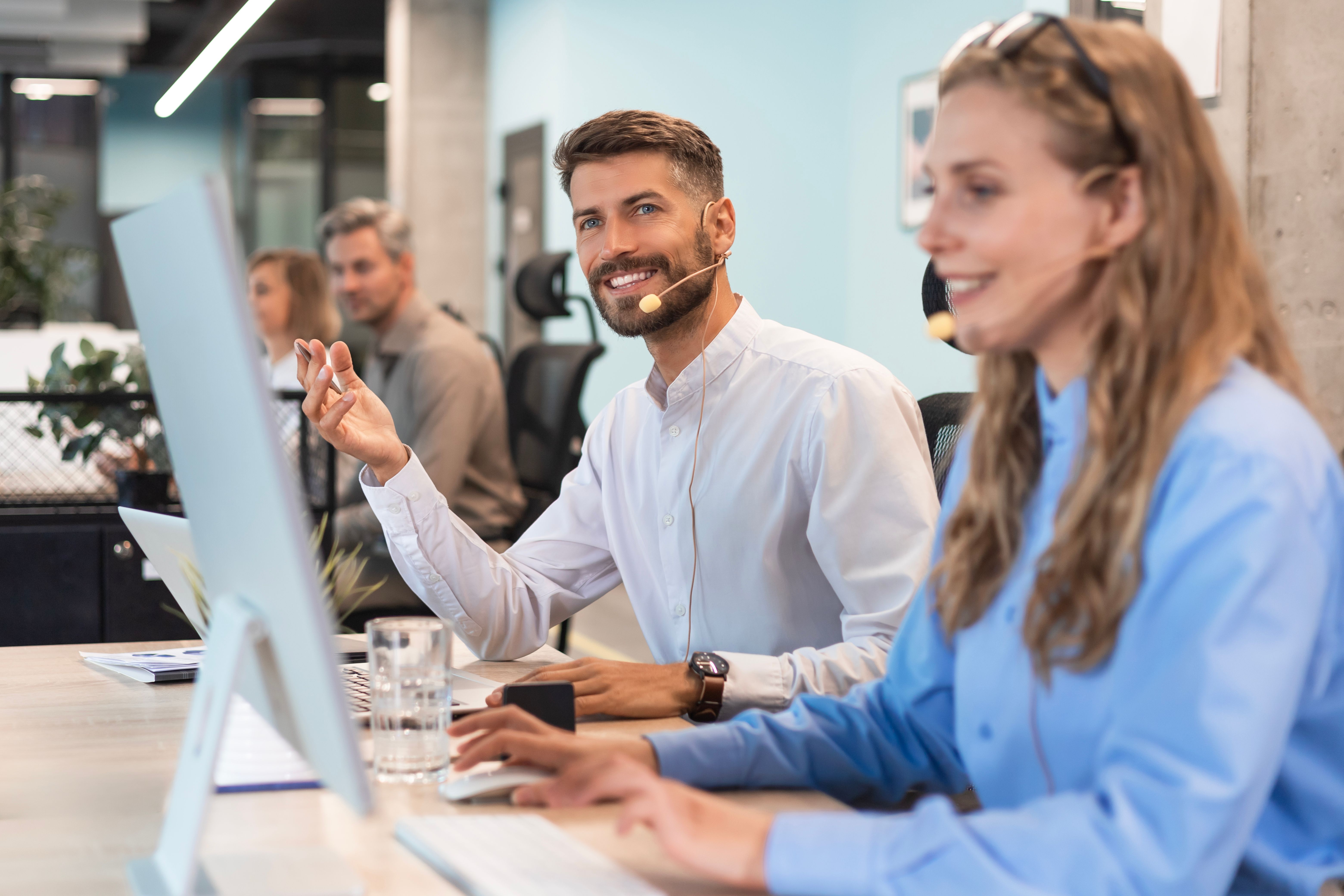 Office of call center, specialist smile, crm and customer service job. Web advice of employee by sales with happiness for clients from telemarketing and internet work on office desk