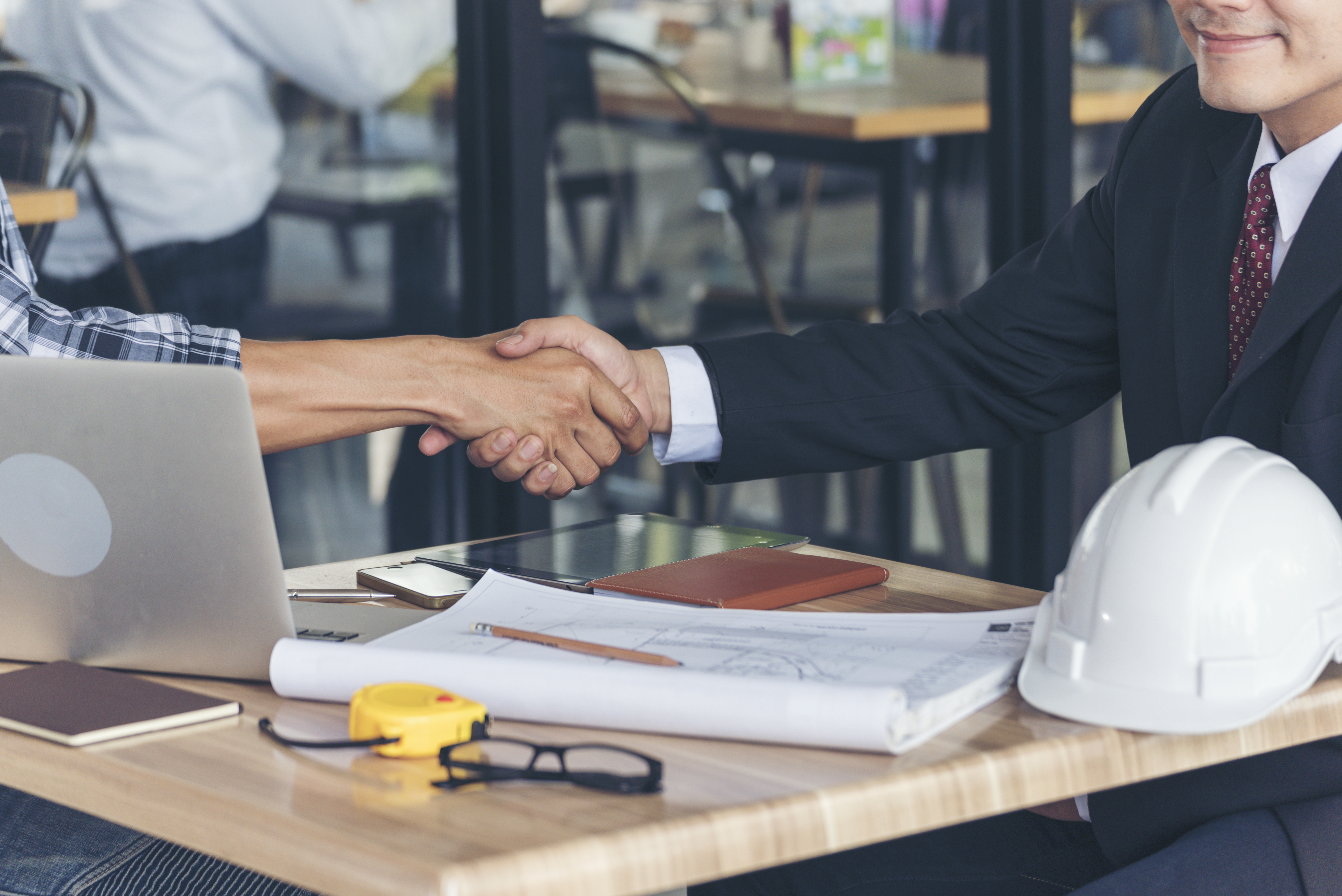 Team Business Partners shaking hands together to Greeting Start up small business in meeting room. Shakehand teamwork partners at modern office handshake together. Business mergers and acquisitions