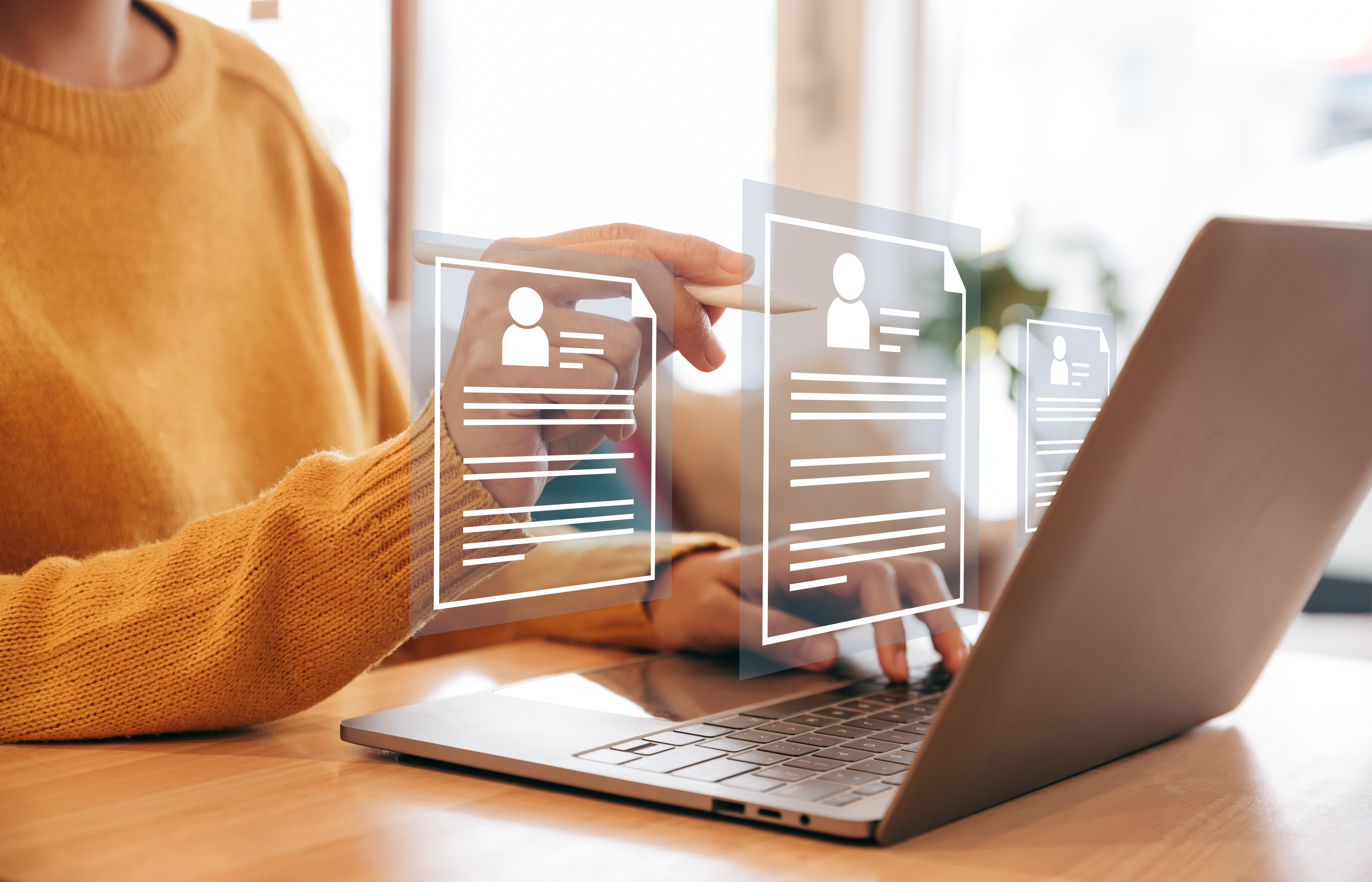 Human resource manager looking at many different cv resume Human resource manager looking at many different cv resume