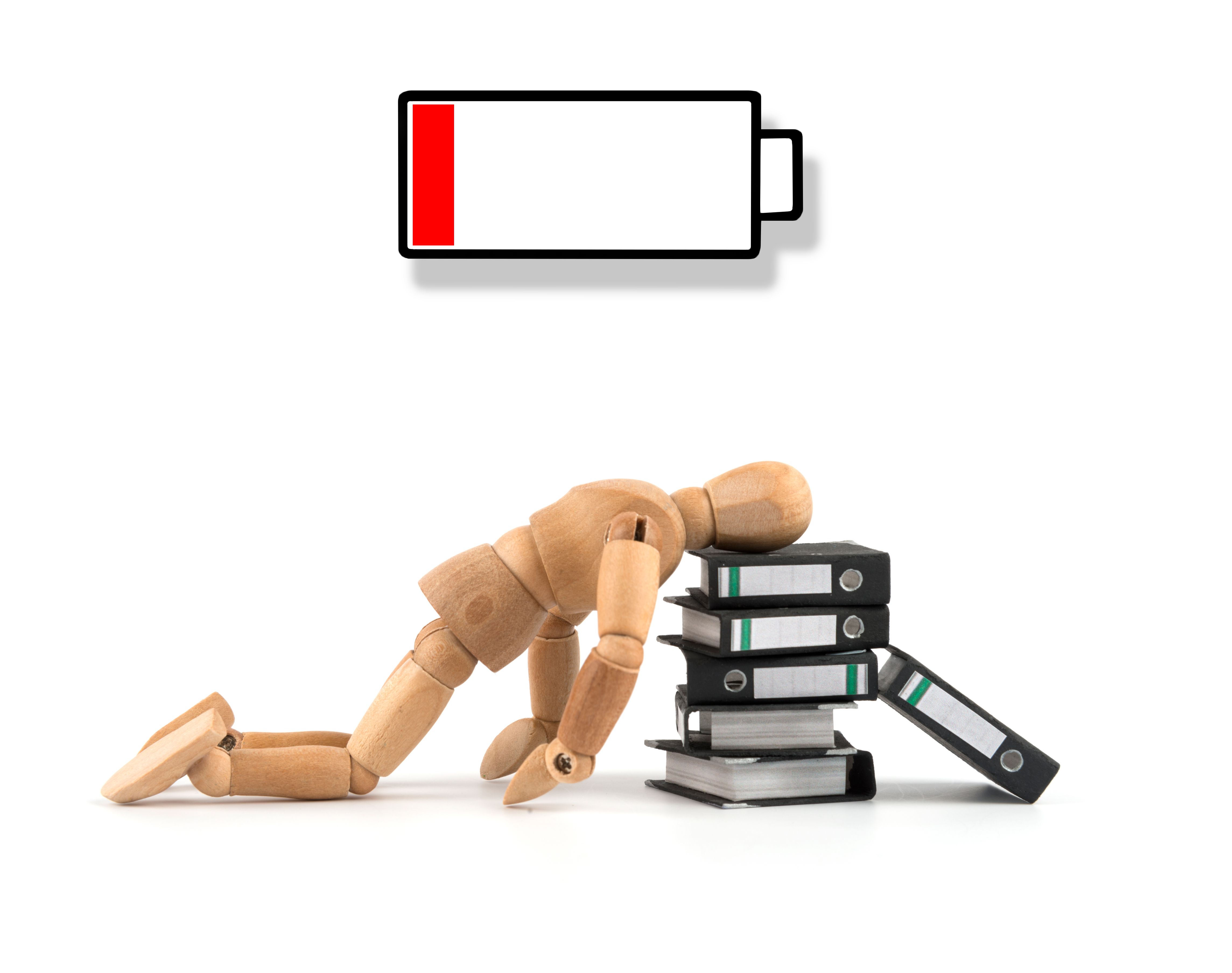Wooden mannequin without energy, burnout, depression - exhausted on folders