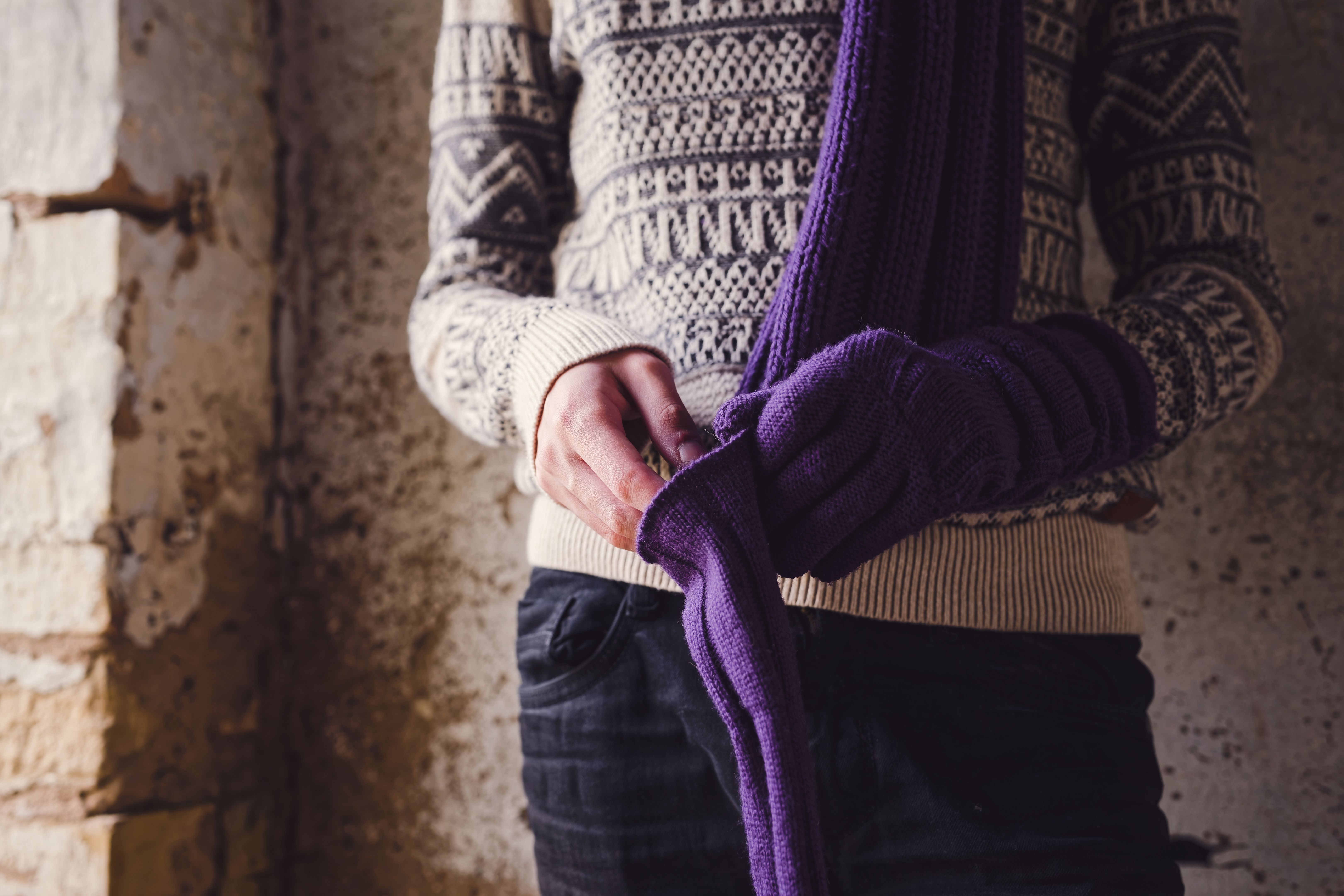 Teenager Putting on Woolen Gloves Standing in the Doorway - Winter Warmth