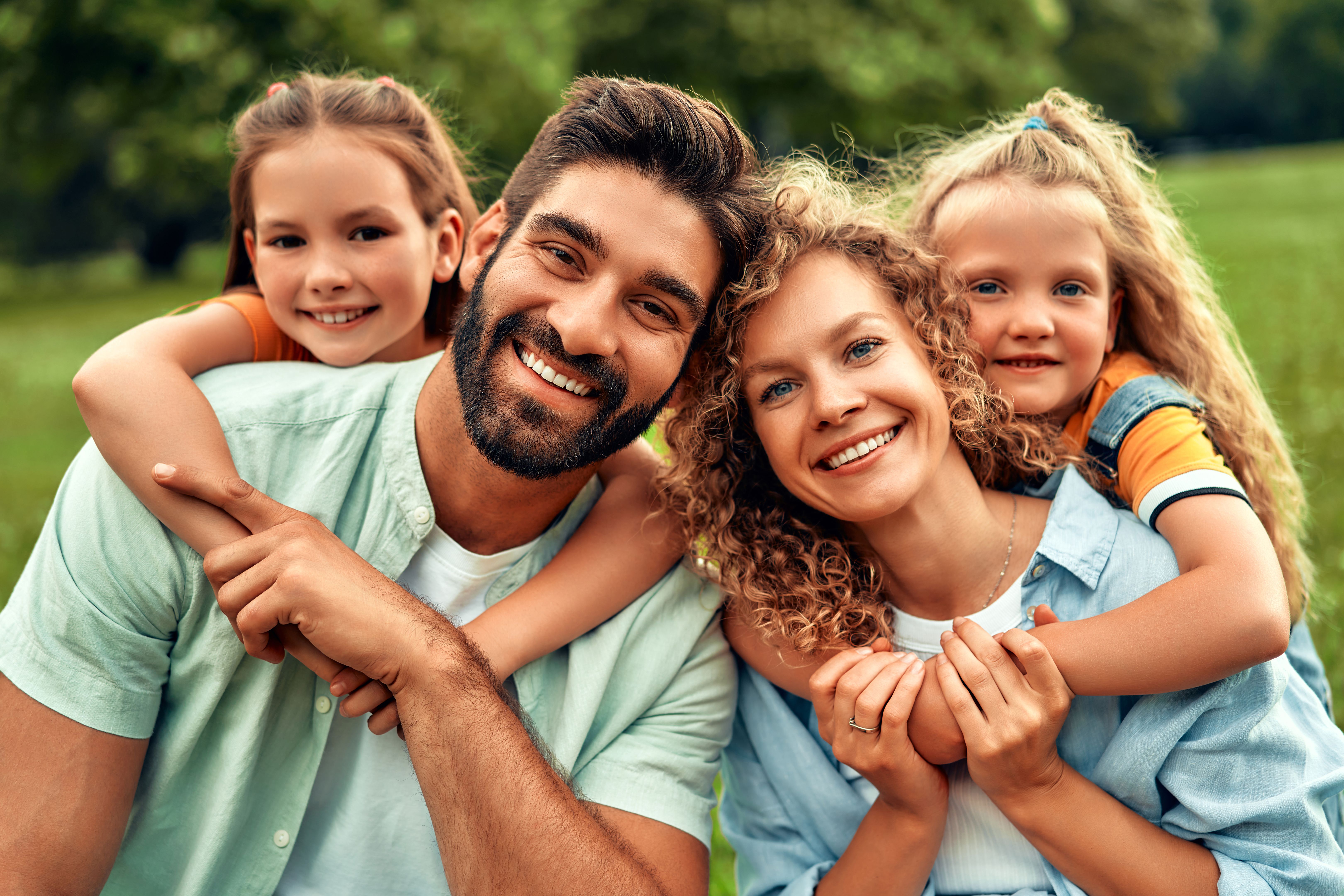 Happy family relaxing in the park