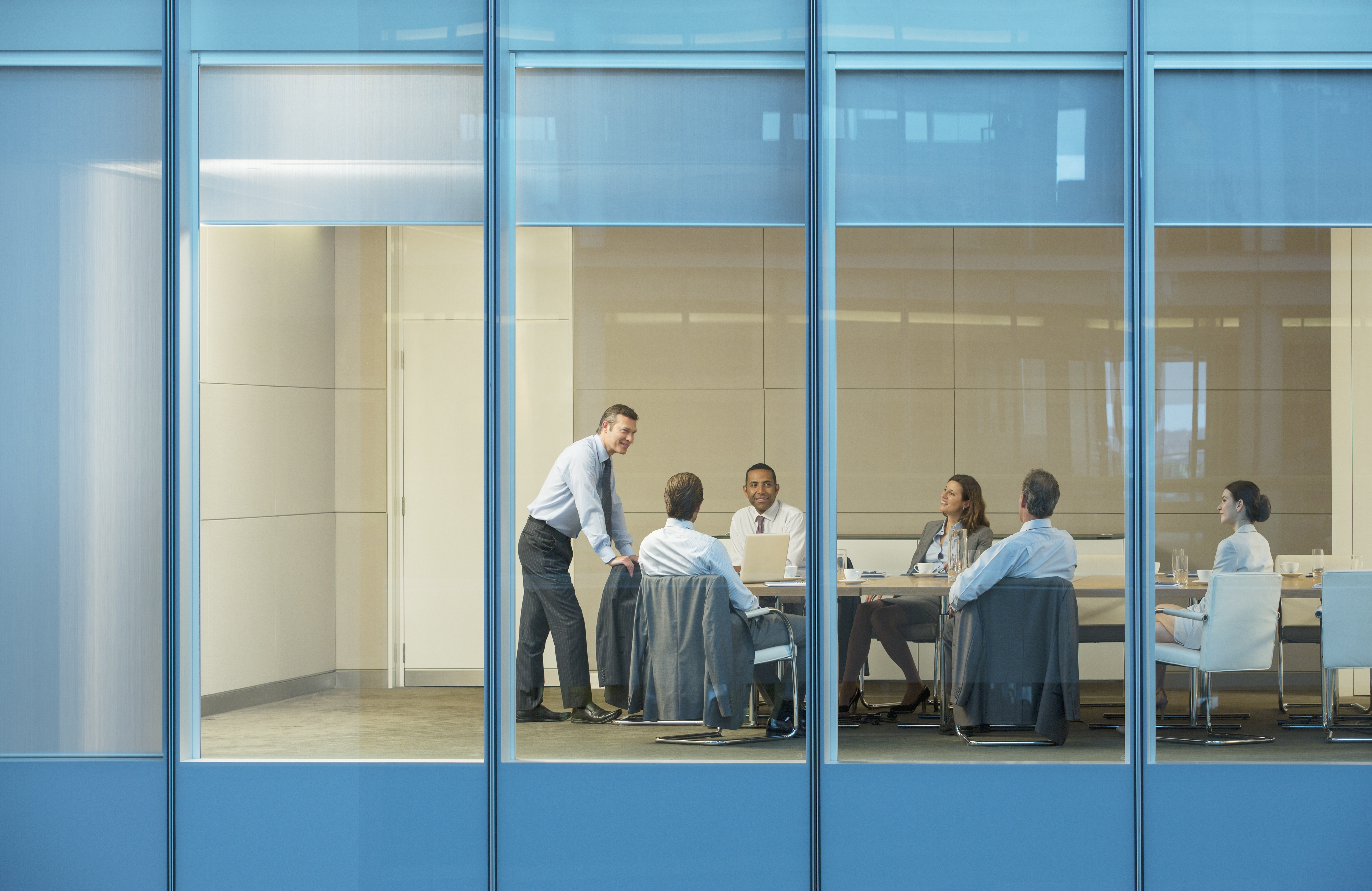 Business people talking in conference room Business people talking in conference room