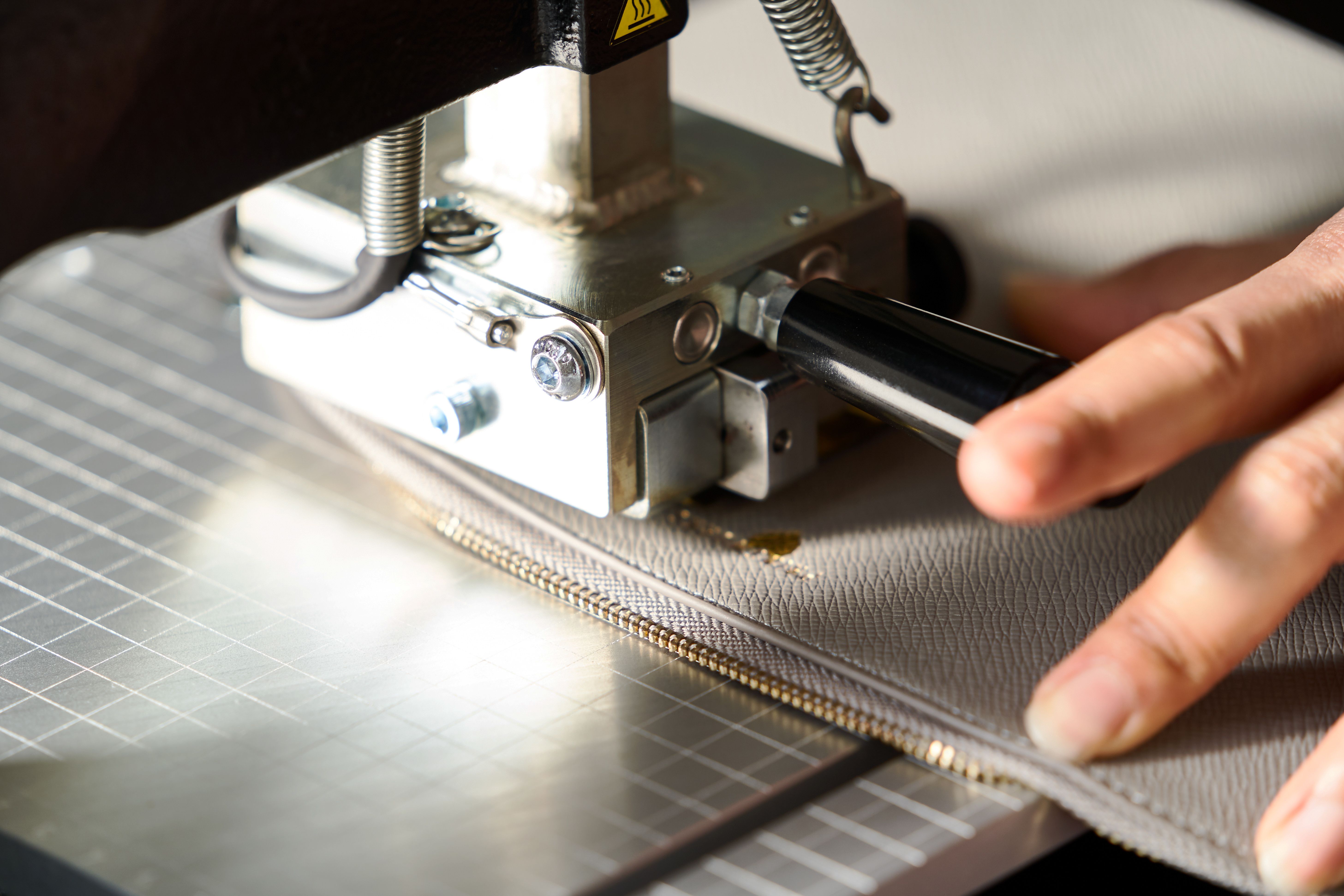 Leather crafting concept with leather engraving machine, close-up