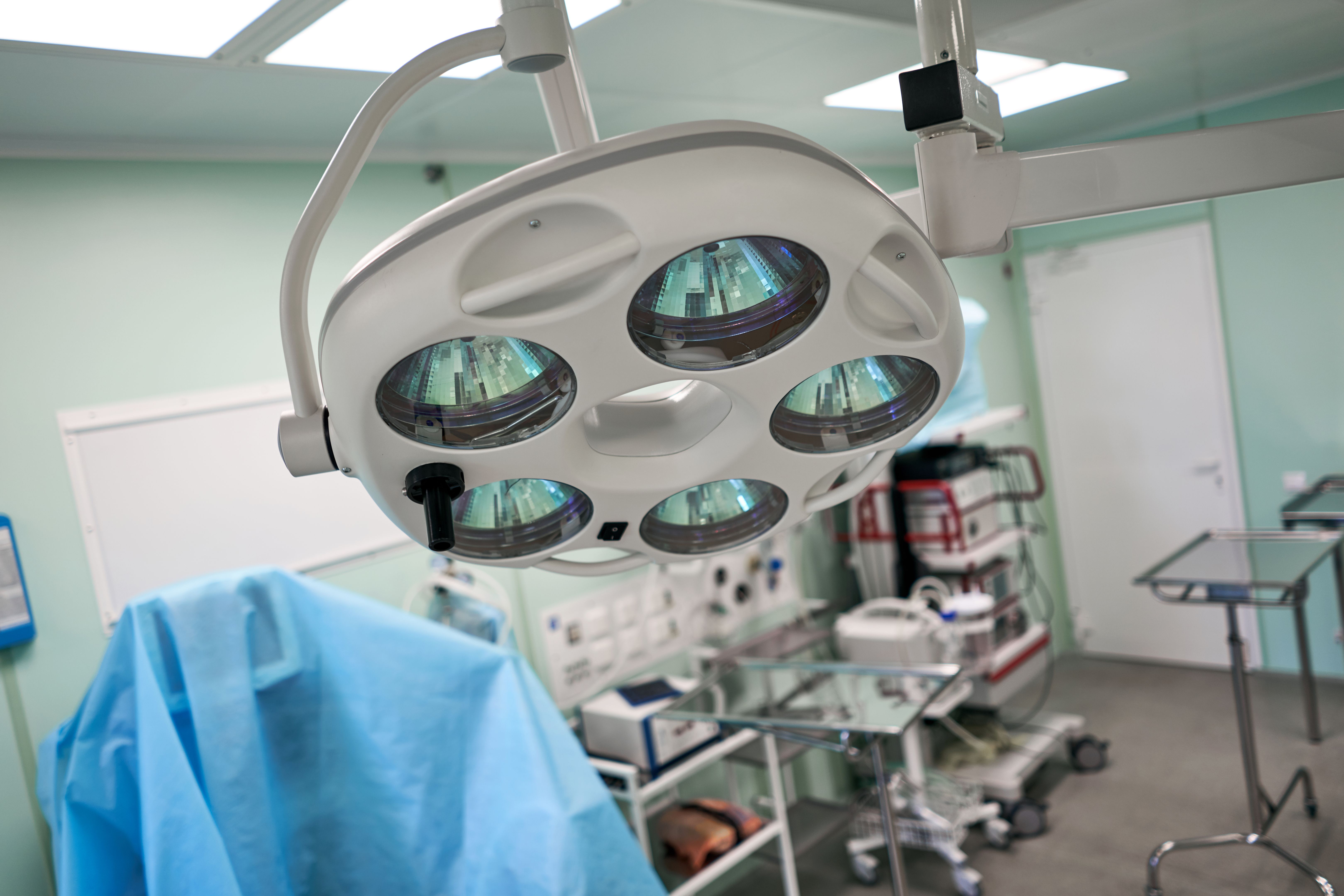lamp above the operating table in an empty room