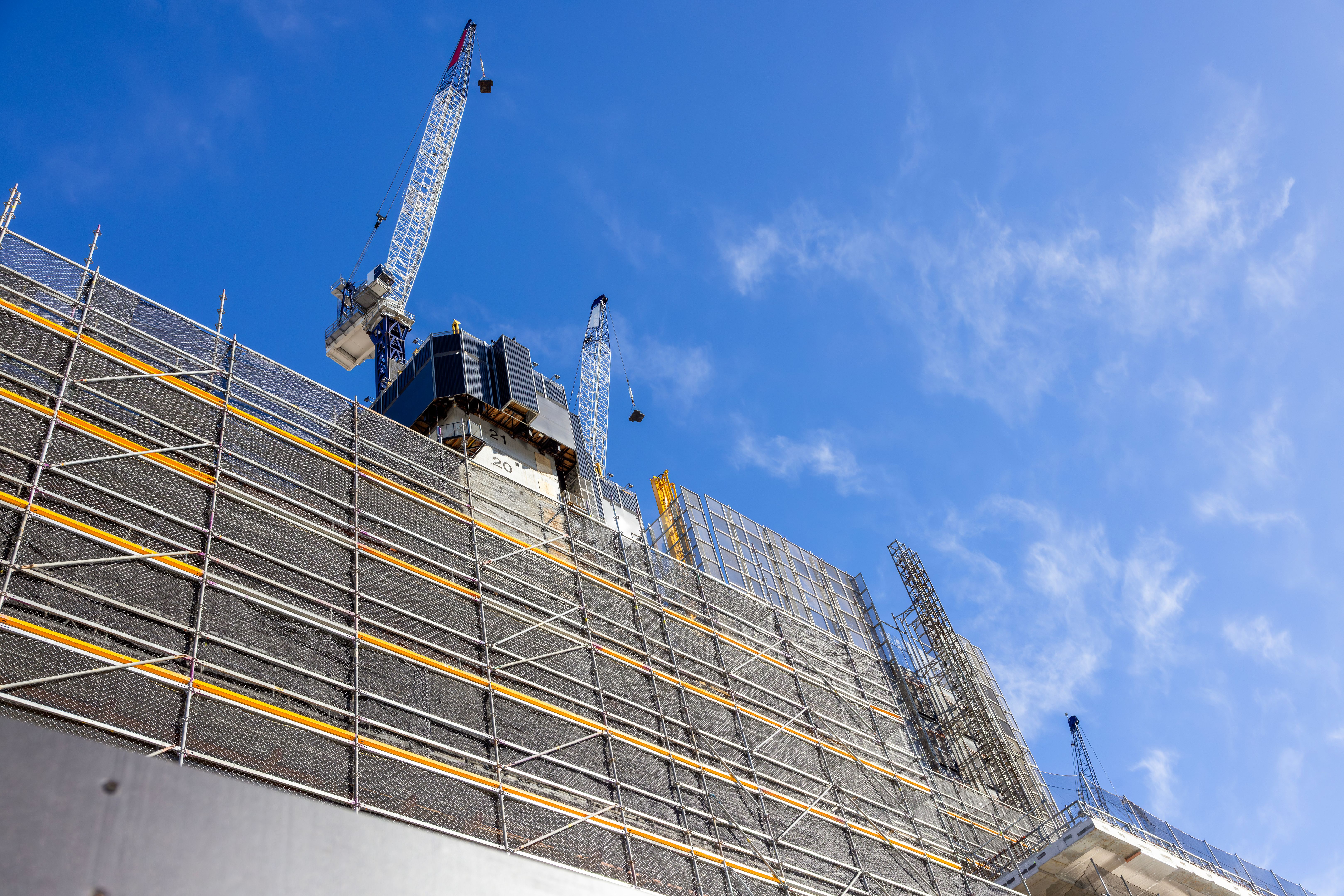 Construction of skyscrapers in the city, blue sky background with copy space Construction of skyscrapers in the city, blue sky background with copy space