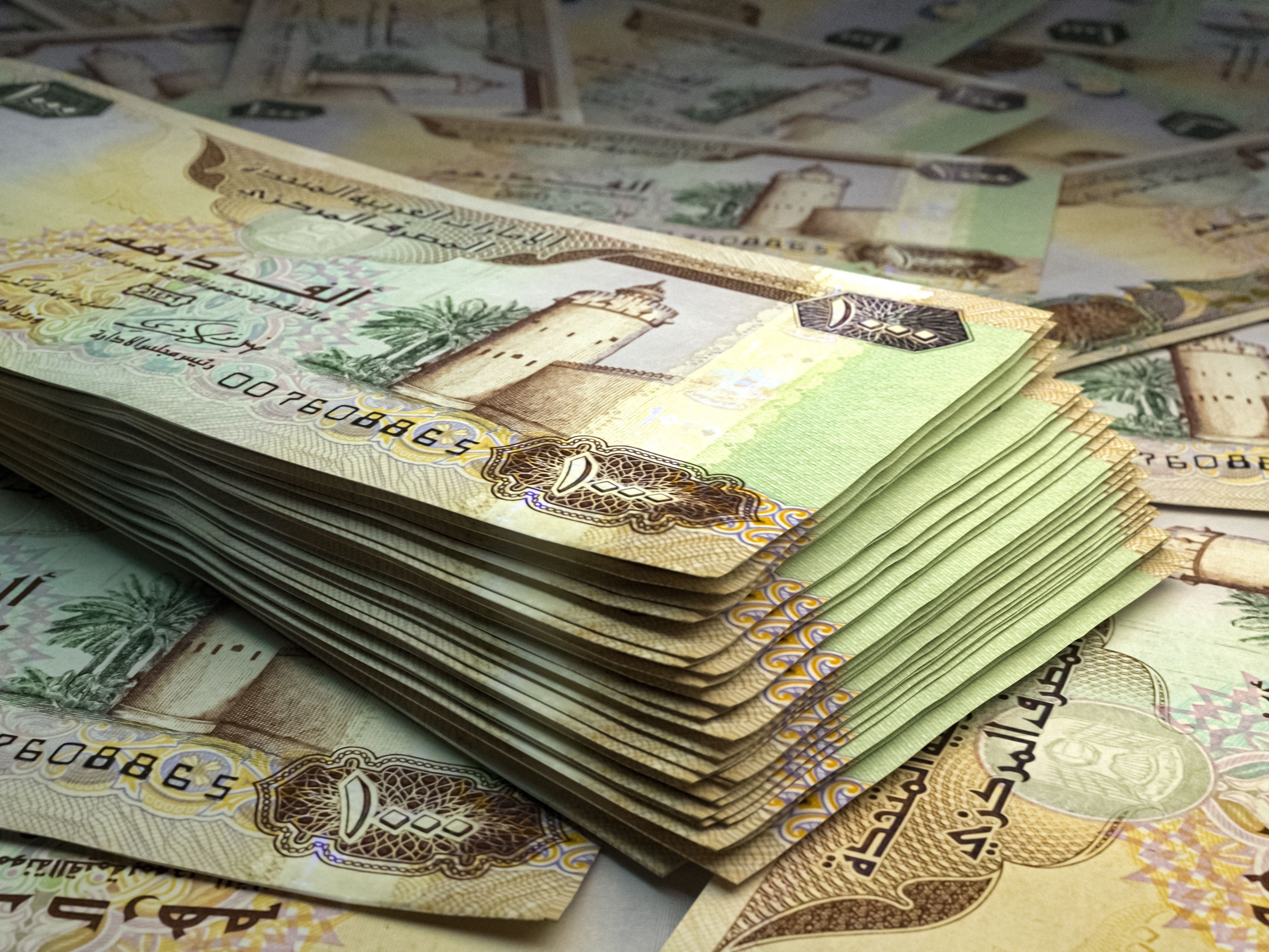 United Arab Emirates banknotes. United Arab Emiratesdirham bills. 1000 AED dirhams. Business, finance background.