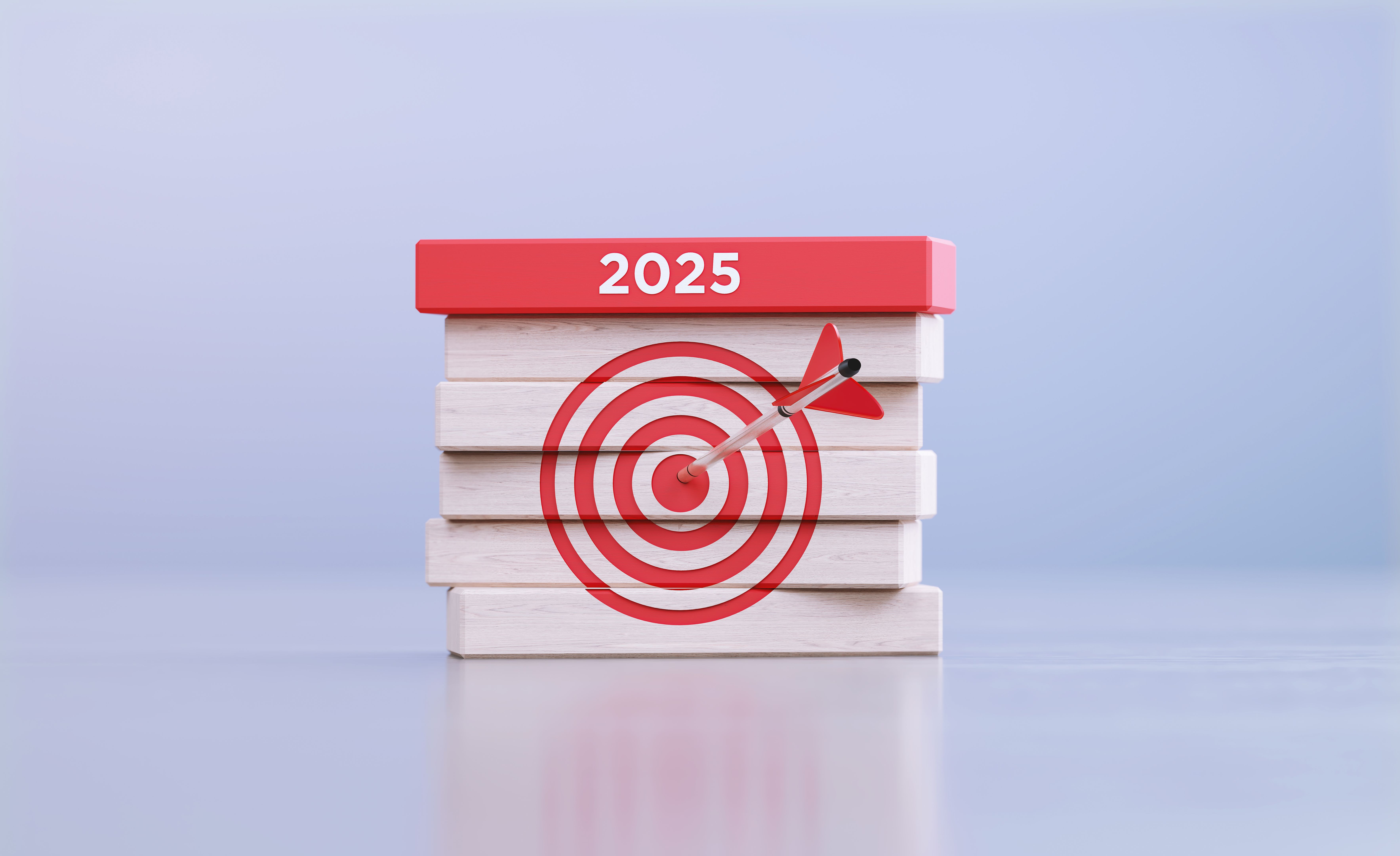 2025 Concept - Arrow Hitting Bull's Eye Target Symbol And 2025 Written Wood Blocks In Front Defocused Background