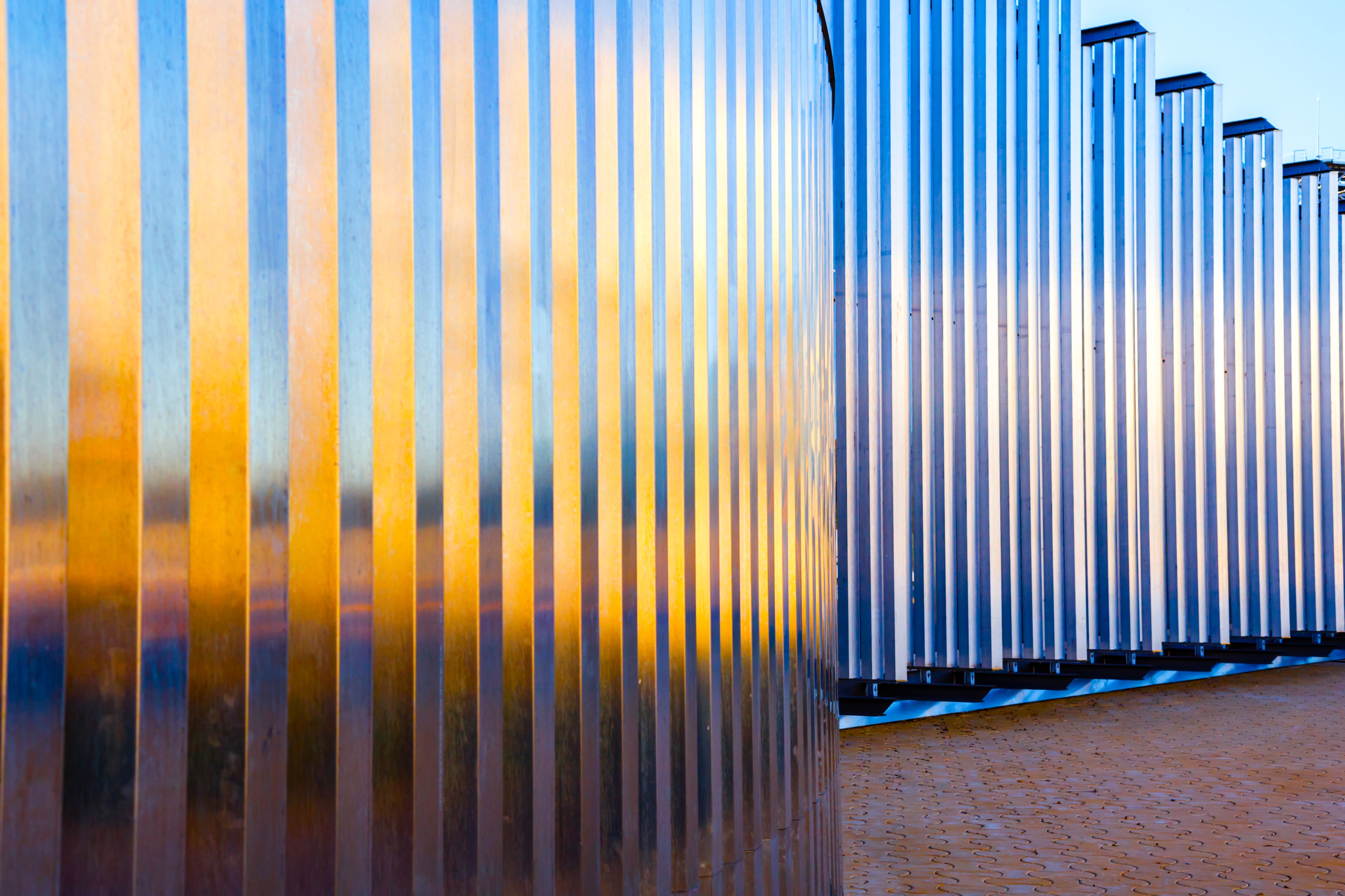 Modern building. Metal structure with the reflection of the sun at sunset in Pelli tower outside area, Seville, Spain