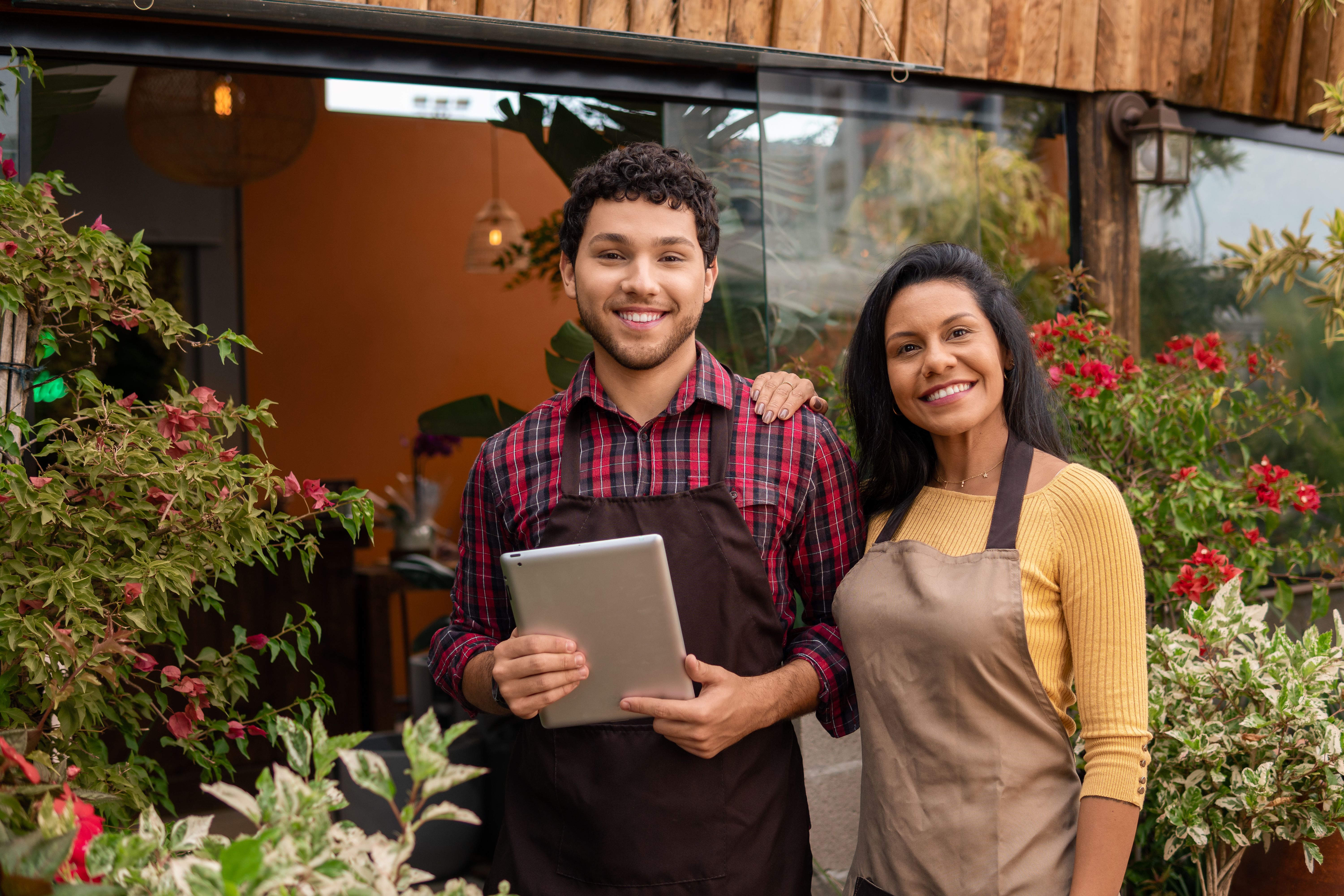 Service team smiles for portrait in a neighborhood trade
