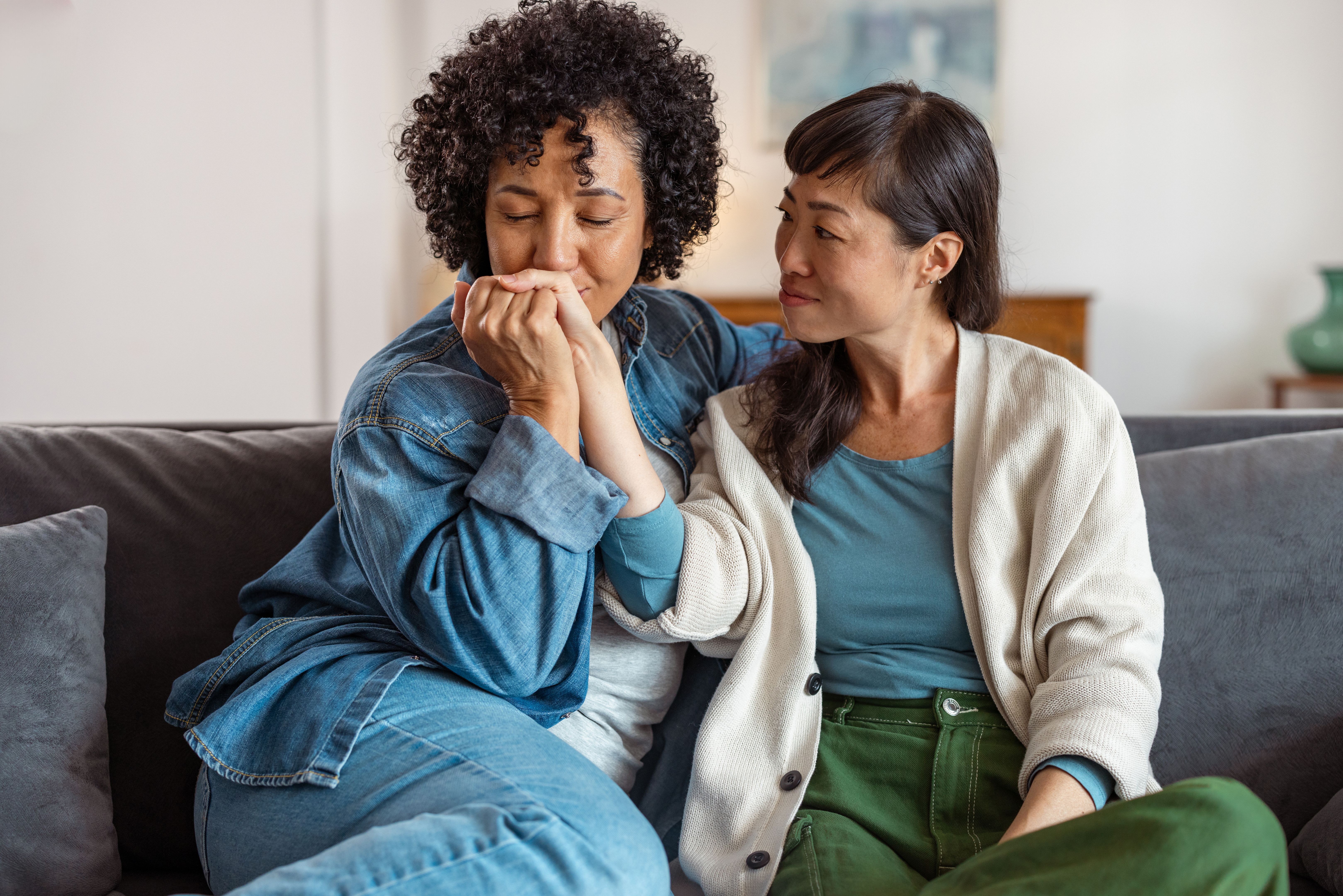 Loving lesbian couple sharing an intimate moment at home Loving lesbian couple sharing an intimate moment at home