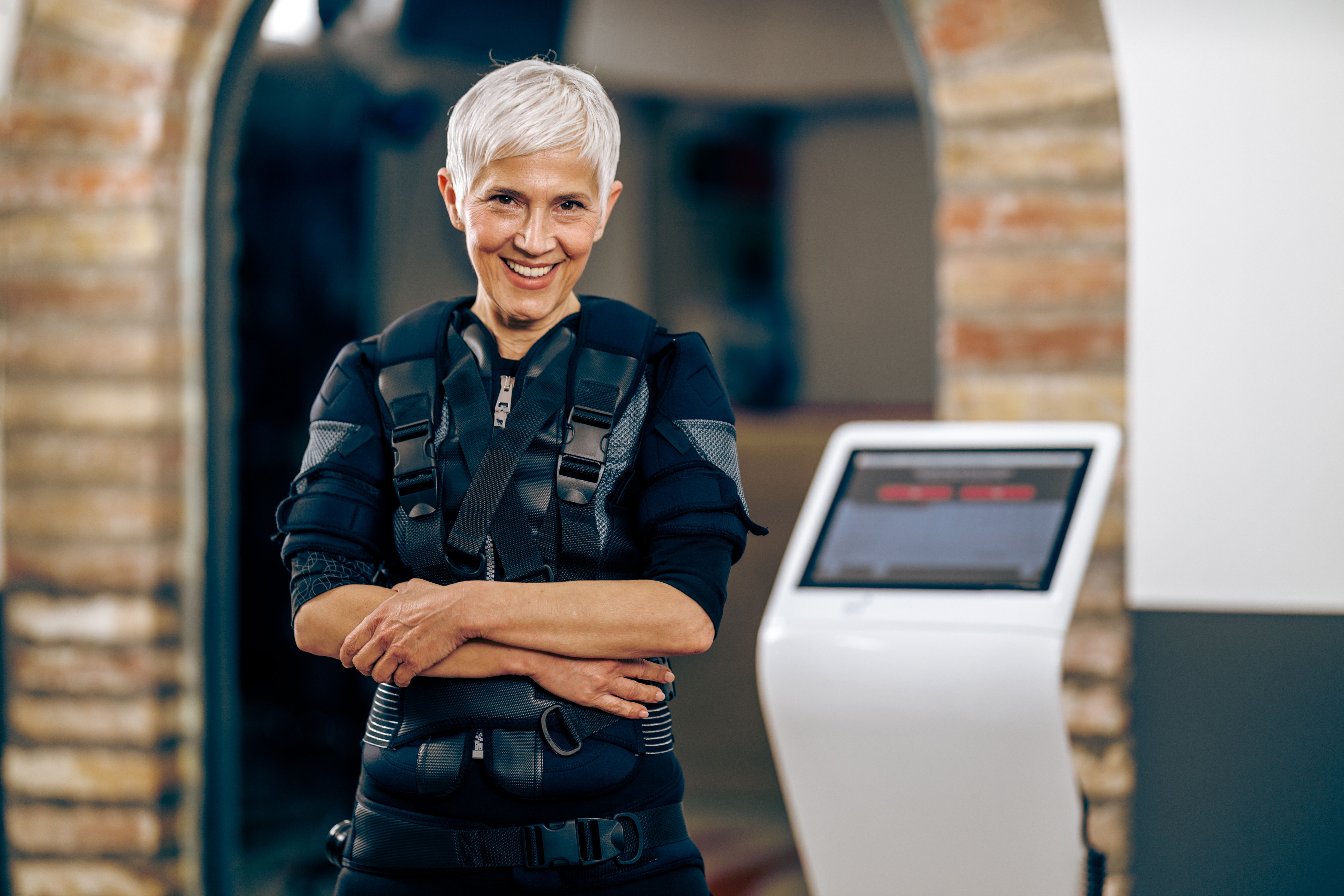 Senior Woman Preparing For EMS Training In The Gym