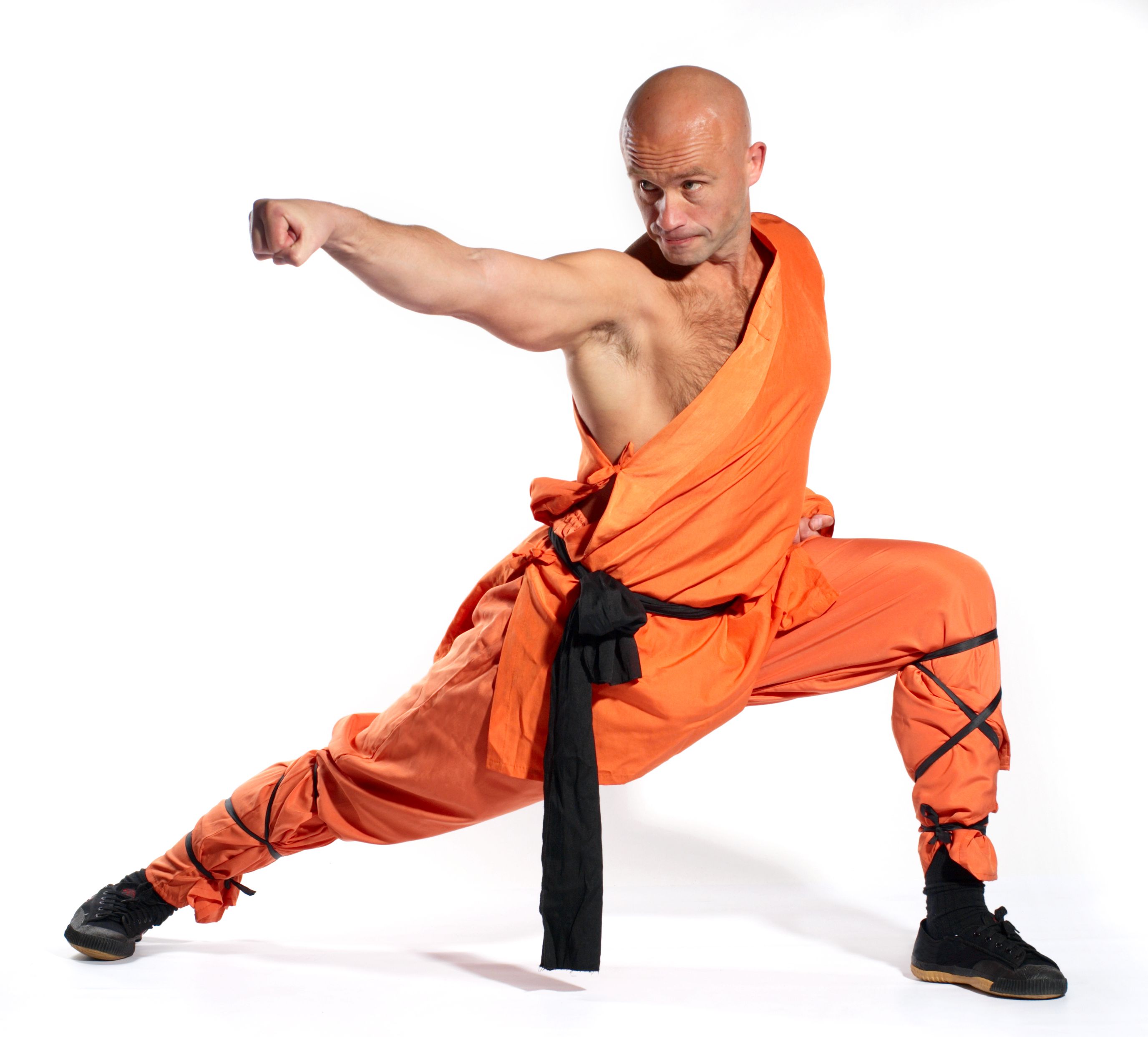 Close-up of a Shaolin Warrior monk training in orange