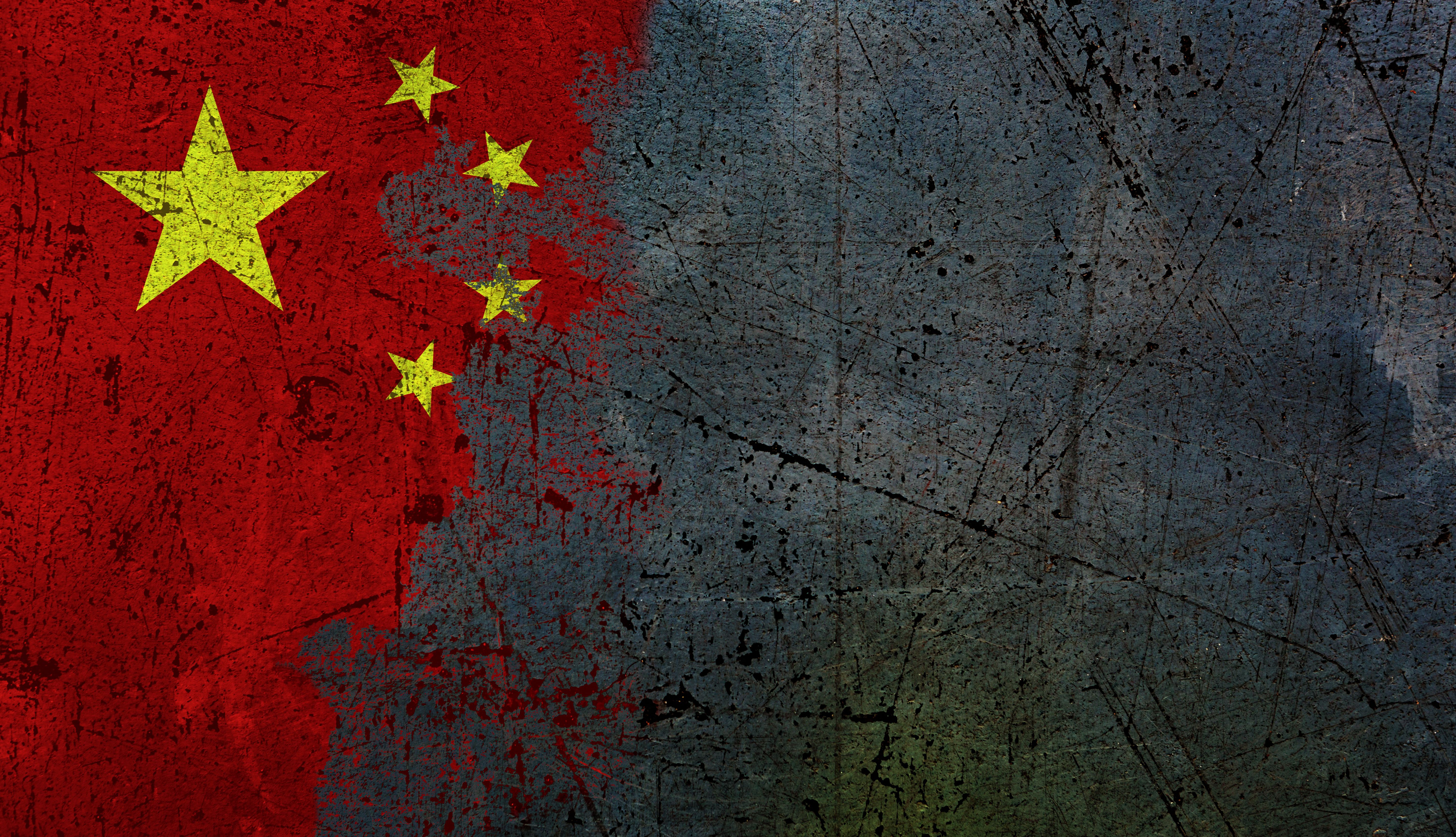 Ominous moment for China: national flag being erased from a scratched grungey concrete wall, with copy space Ominous moment for China: national flag being erased from a scratched grungey concrete wall, with copy space